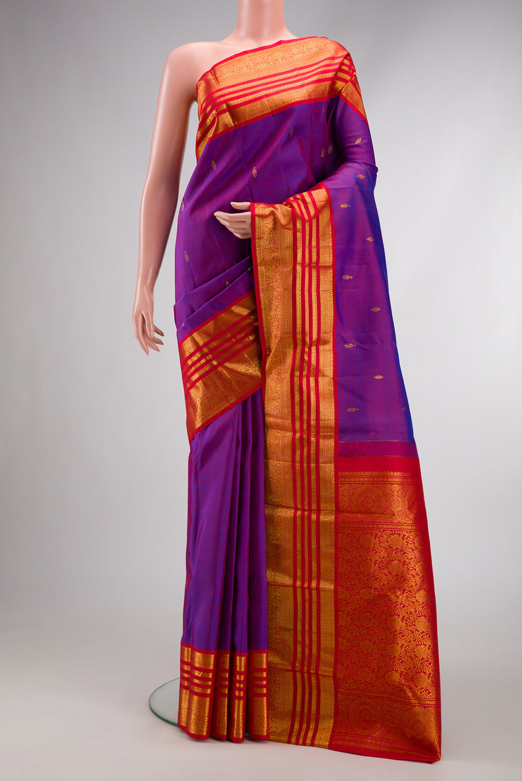 Purple Dual Tone Kanjivaram Silk Saree with Zari Butta on the body and Zari Border.  displayed on a mannequin
