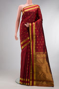 Maroon Kanjivaram Silk Saree with Zari Butta on the body and Zari Border.  displayed on a mannequin
