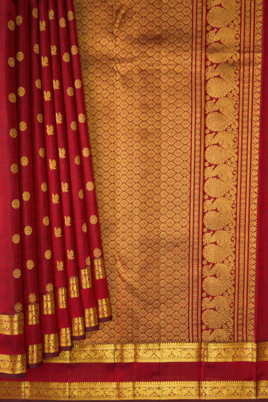 Pleats and pallu of Maroon Kanjivaram Silk Saree with Zari Butta on the body and Zari Border. 