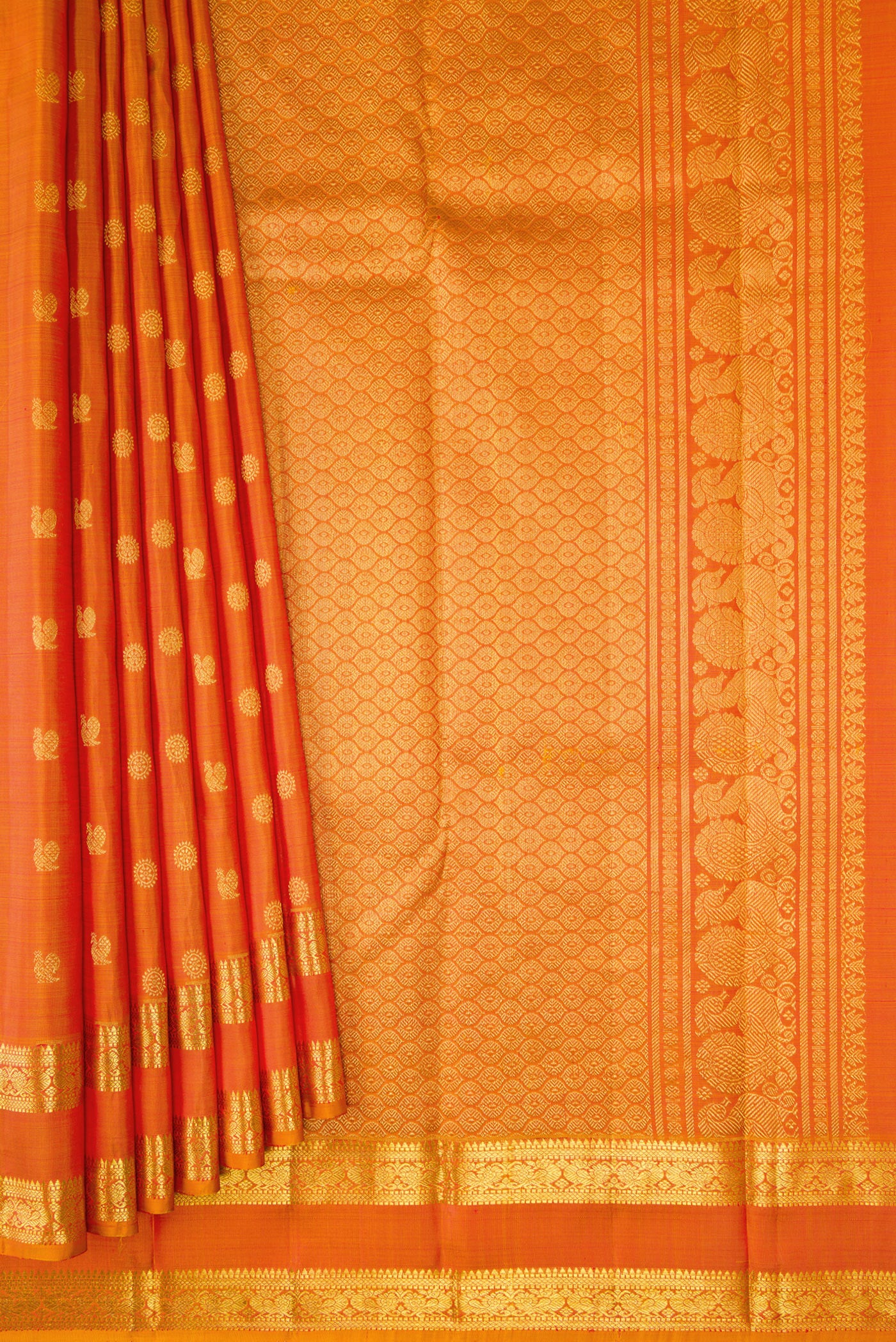 Pleats and pallu of Orange Dual Tone Kanjivaram Silk Saree with Zari Butta on the body and Zari Border. 