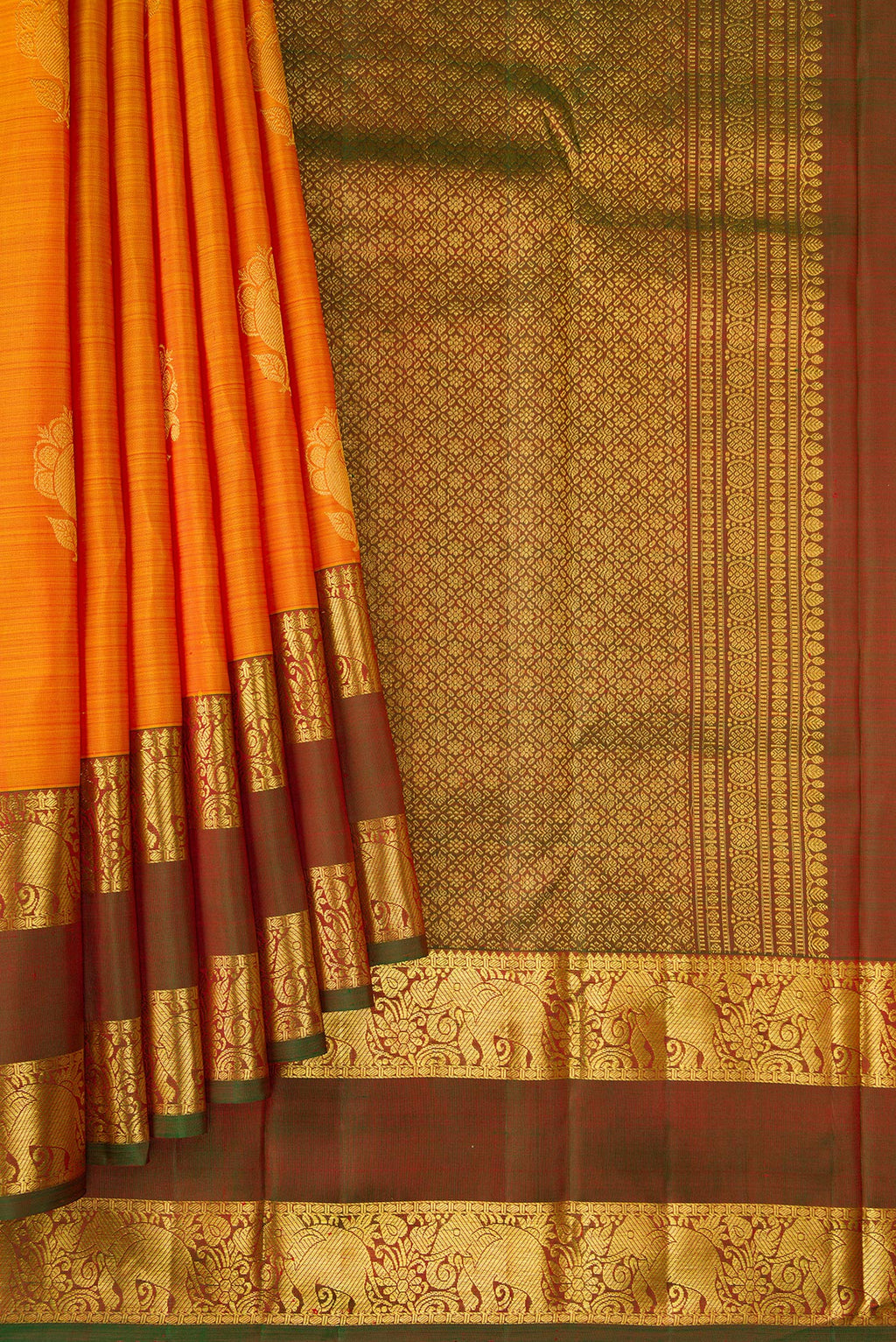 Pleats and pallu of Mustard Dual Tone Kanchipuram Silk Saree with Zari Butta on the body and Zari Border. 