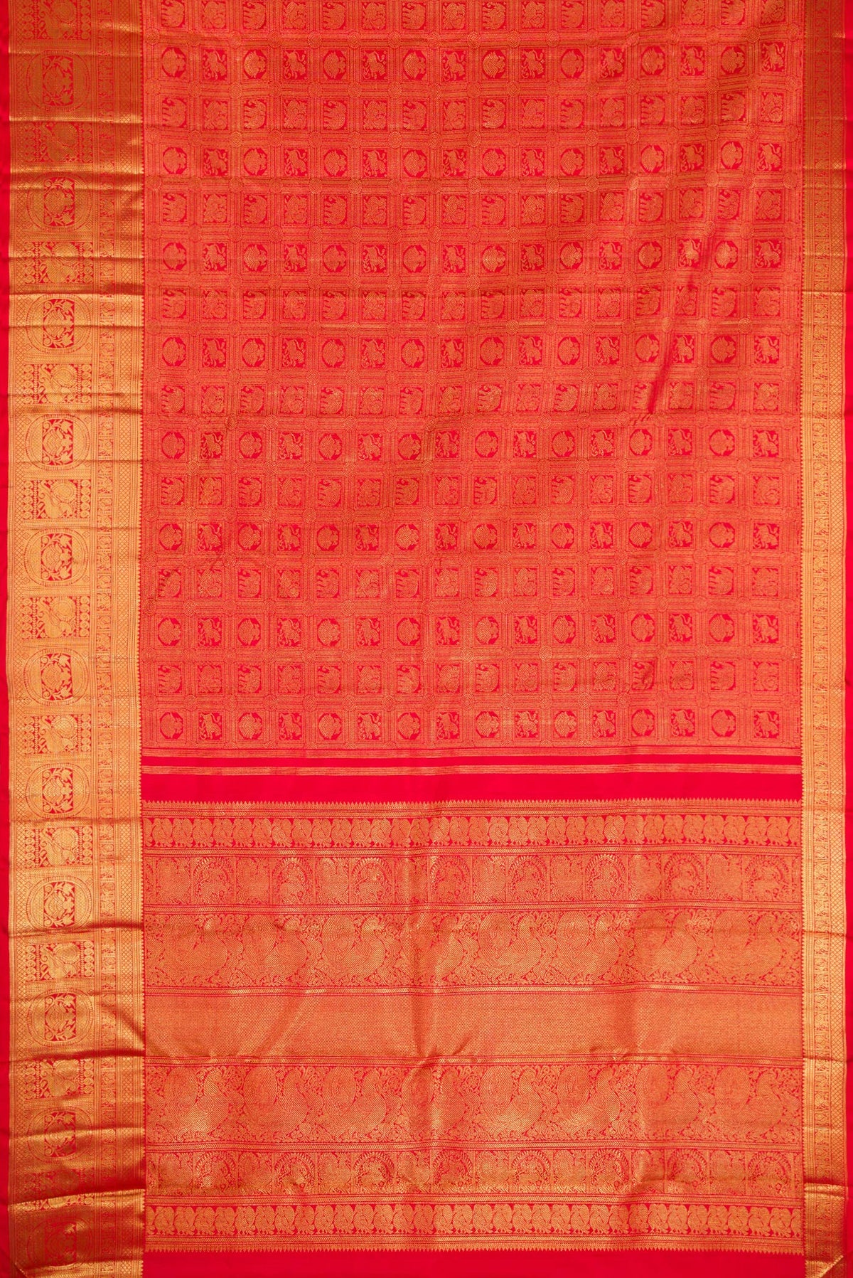 Flat view of Pure Silk Pure Zari Red Dual Tone Kanjivaram Saree with Zari Brocade on the body and Zari Border. 