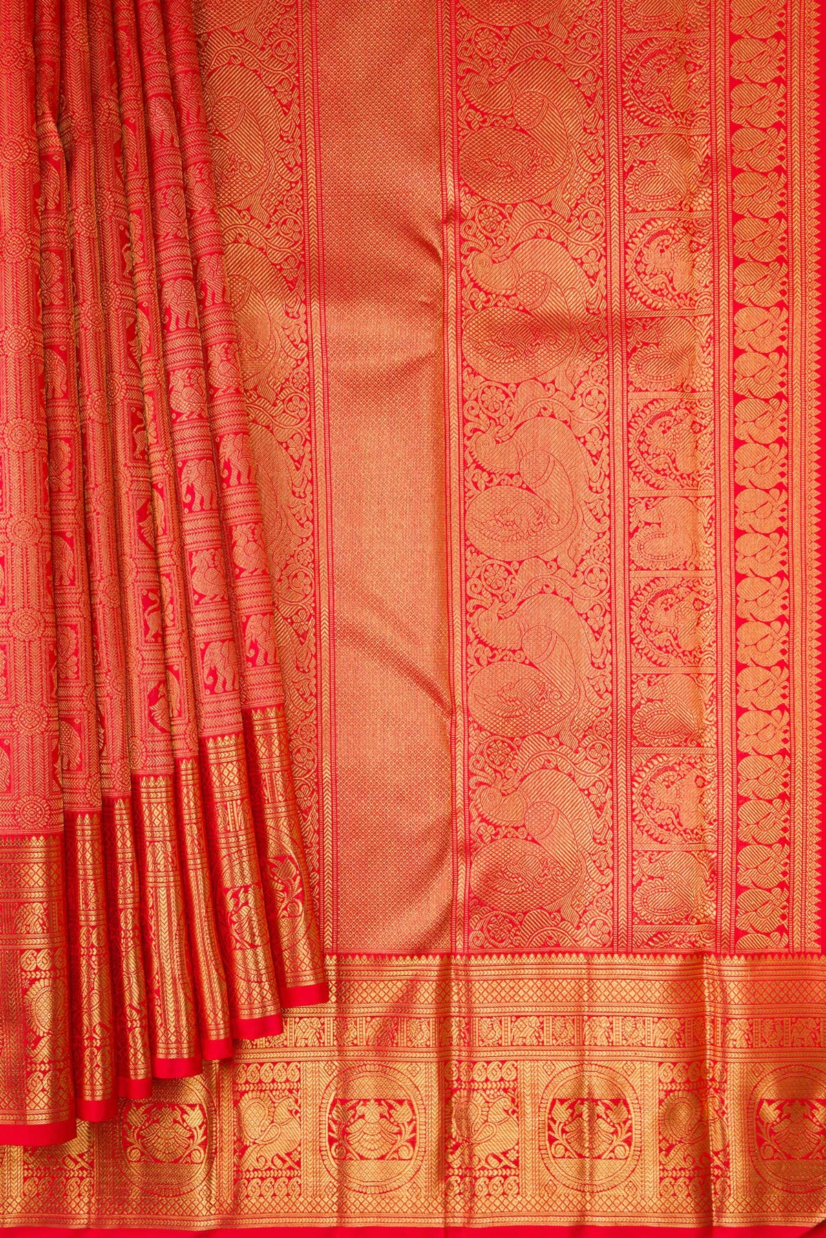 Pleats and pallu of Pure Silk Pure Zari Red Dual Tone Kanjivaram Saree with Zari Brocade on the body and Zari Border. 