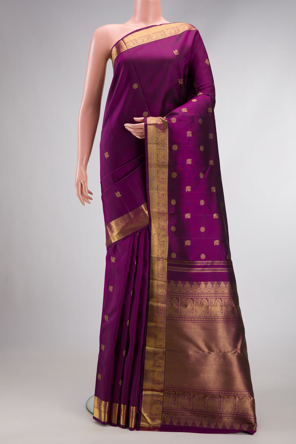Pure Silk Pure Zari Purple Dual Tone Kanjivaram Saree with Zari Butta on the body and Zari Border.  displayed on a mannequin