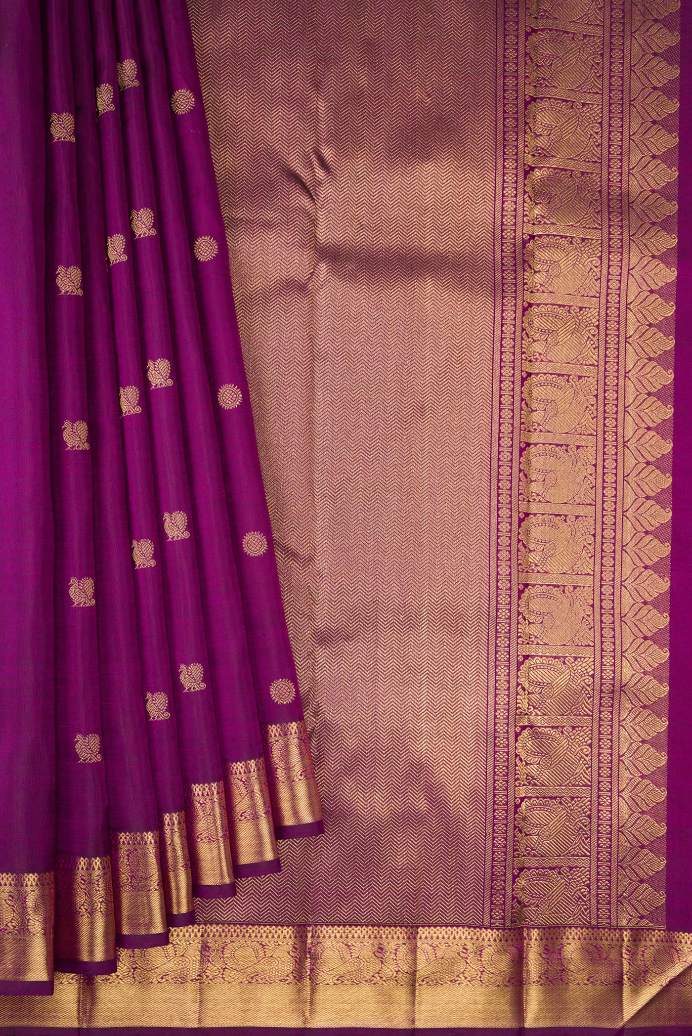 Pleats and pallu of Pure Silk Pure Zari Purple Dual Tone Kanjivaram Saree with Zari Butta on the body and Zari Border. 