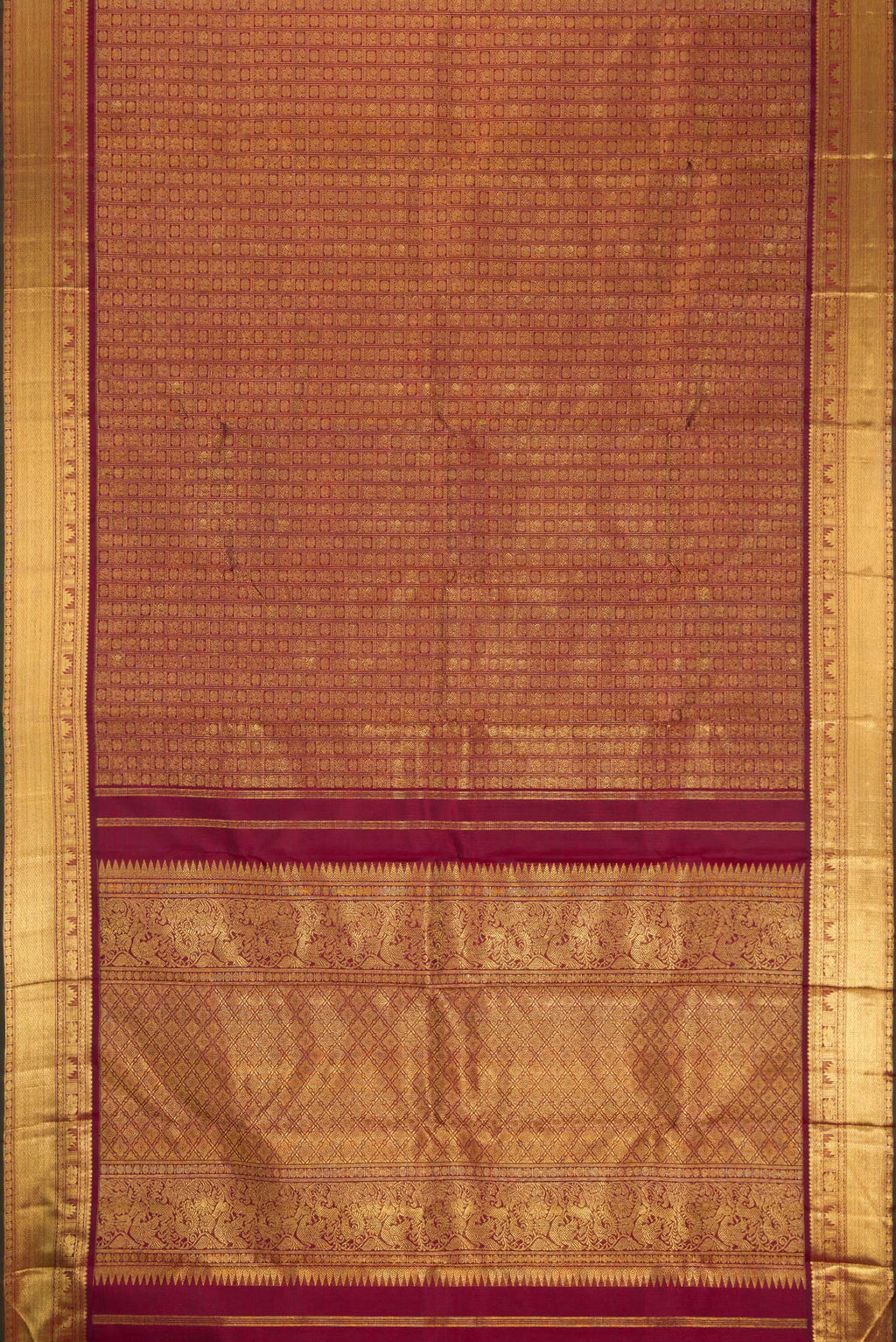 Flat view of Pure Silk Pure Zari Maroon Kanjivaram Saree with Zari Brocade on the body and Zari Border. 
