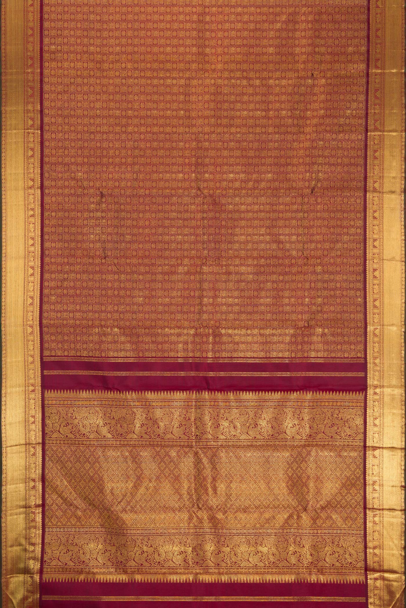 Flat view of Pure Silk Pure Zari Maroon Kanjivaram Saree with Zari Brocade on the body and Zari Border. 