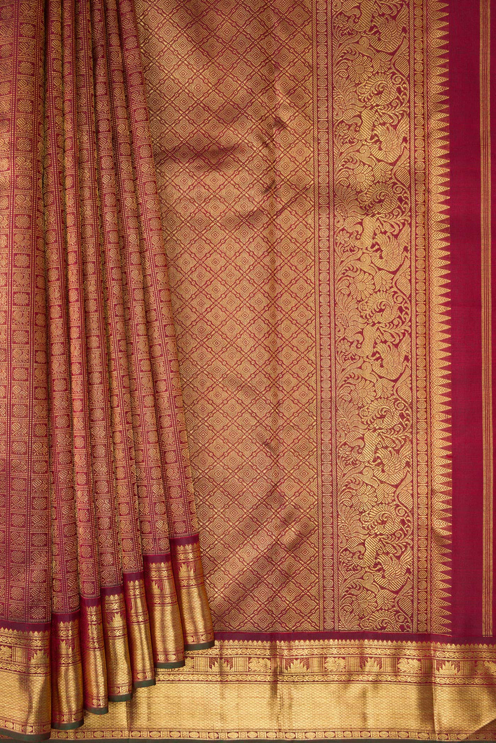 Pleats and pallu of Pure Silk Pure Zari Maroon Kanjivaram Saree with Zari Brocade on the body and Zari Border. 