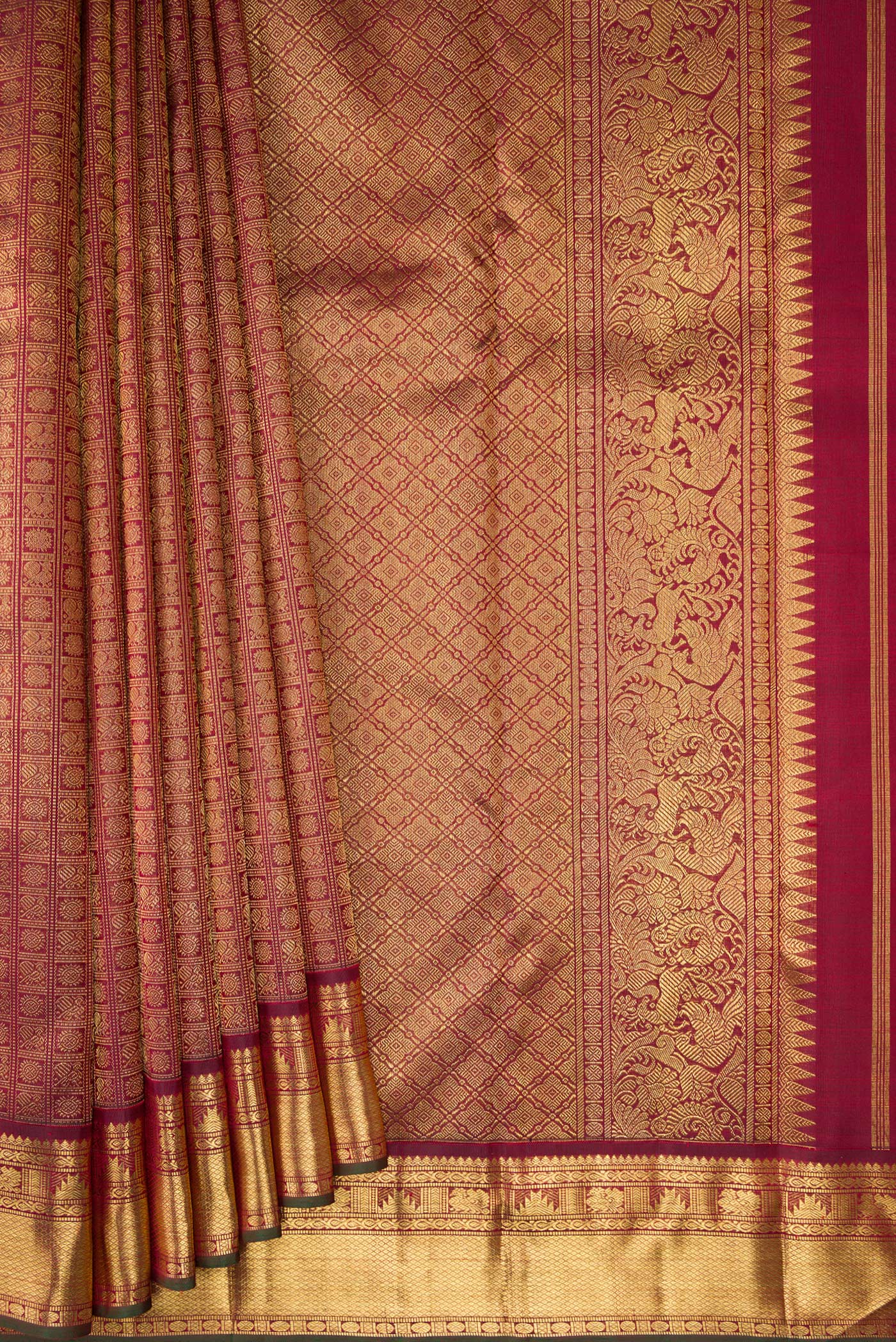 Pleats and pallu of Pure Silk Pure Zari Maroon Kanjivaram Saree with Zari Brocade on the body and Zari Border. 