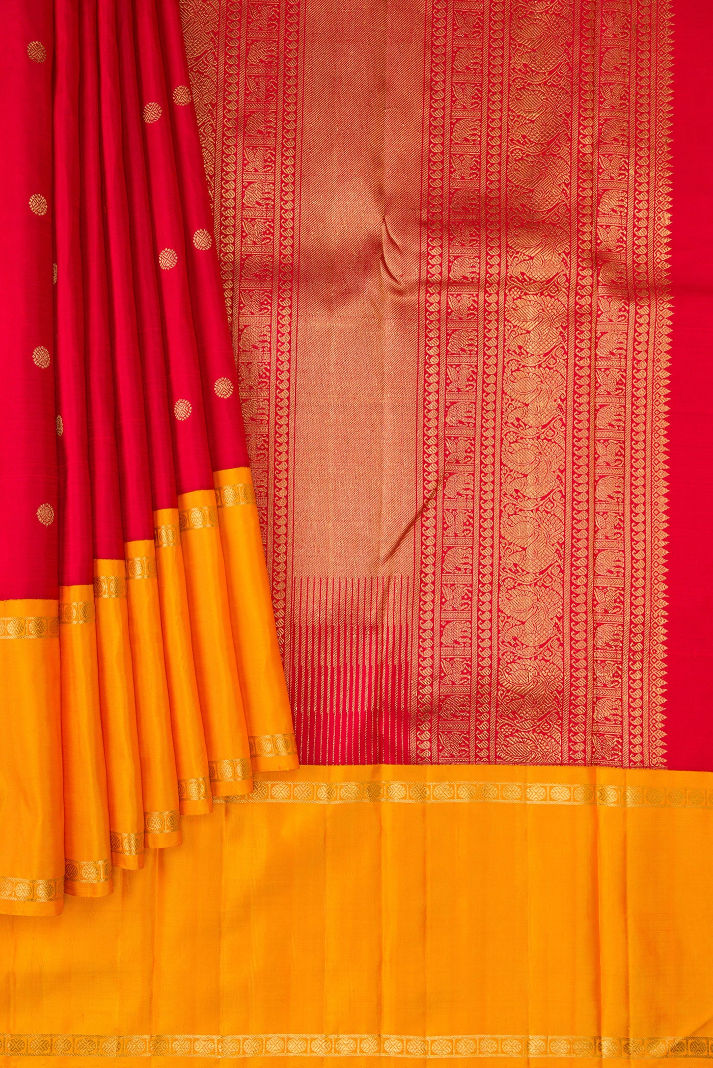 Pleats and pallu of Red Dual Tone Kanjivaram Silk Saree with Zari Butta on the body and Ganga Jamuna Border. 