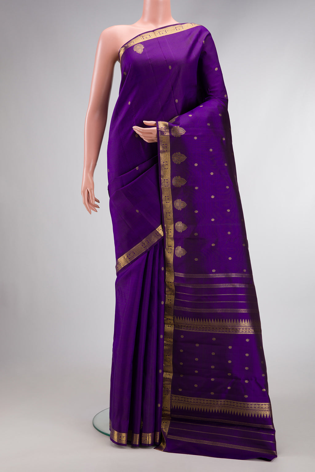 Pure Silk Pure Zari Royal Blue Dual Tone Kanchipuram Saree with Zari Butta on the body and Zari Border.  displayed on a mannequin