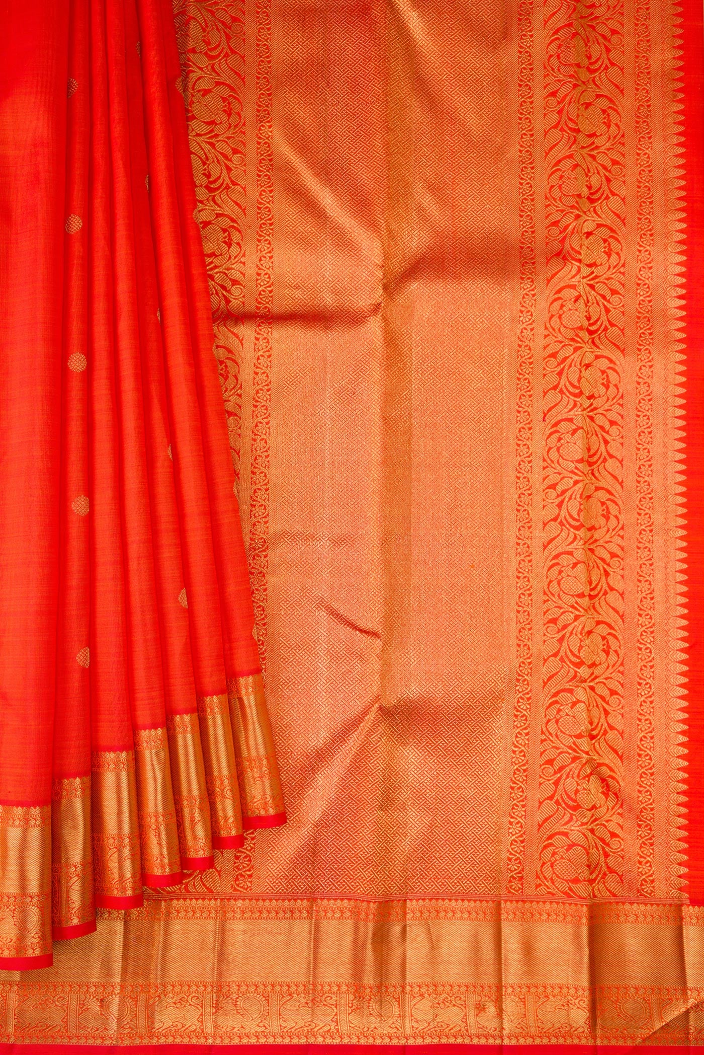 Pleats and pallu of Pure Silk Pure Zari Orange Dual Tone Kanjivaram Saree with Zari Butta on the body and Zari Border. 