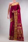 Pure Silk Pure Zari Dark Mauve Dual Tone Kanjivaram Saree with Zari Butta on the body and Zari Border.  displayed on a mannequin