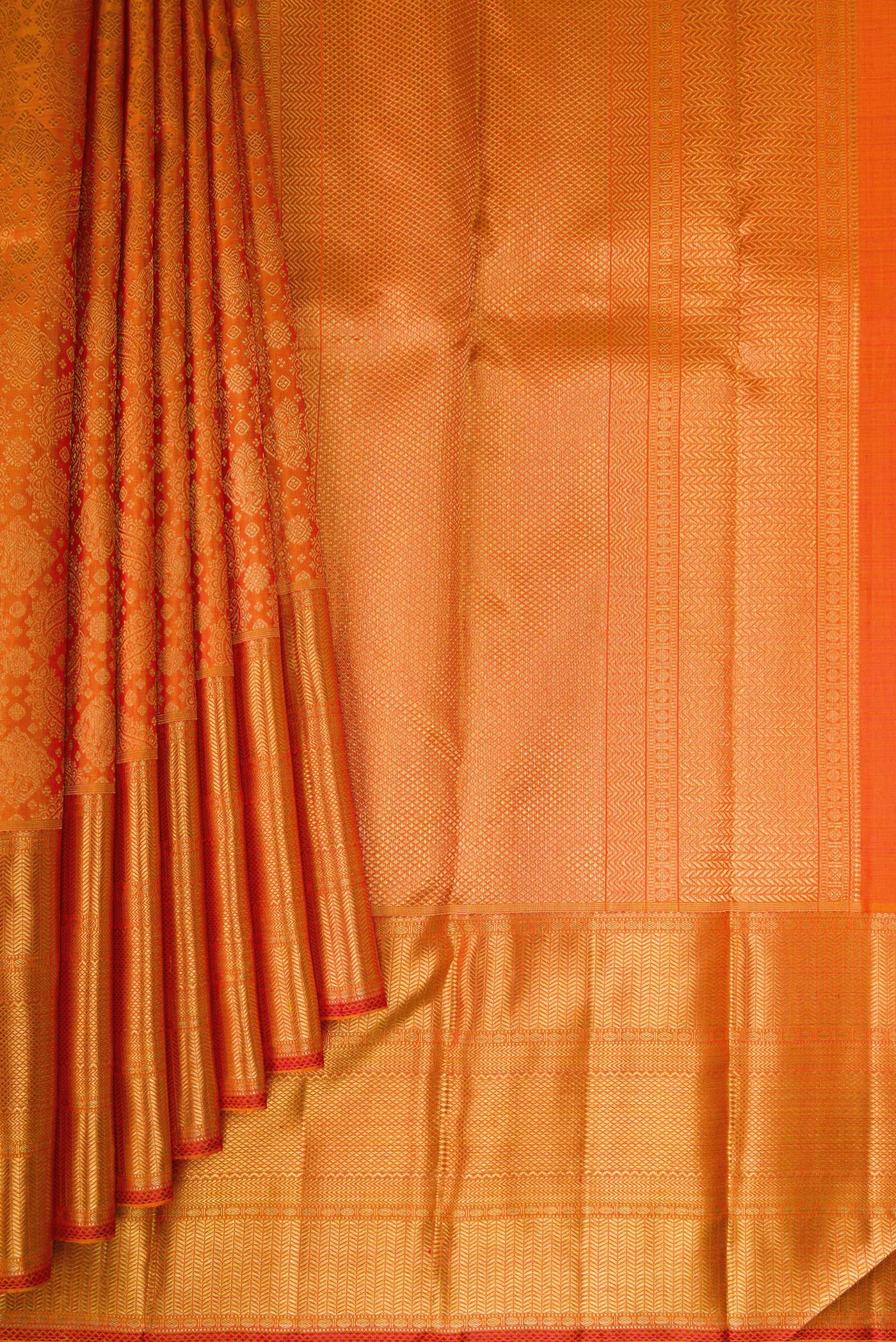 Pleats and pallu of Pure Silk Pure Zari Orange Kanjivaram Saree with Zari Brocade on the body and Zari Border. 