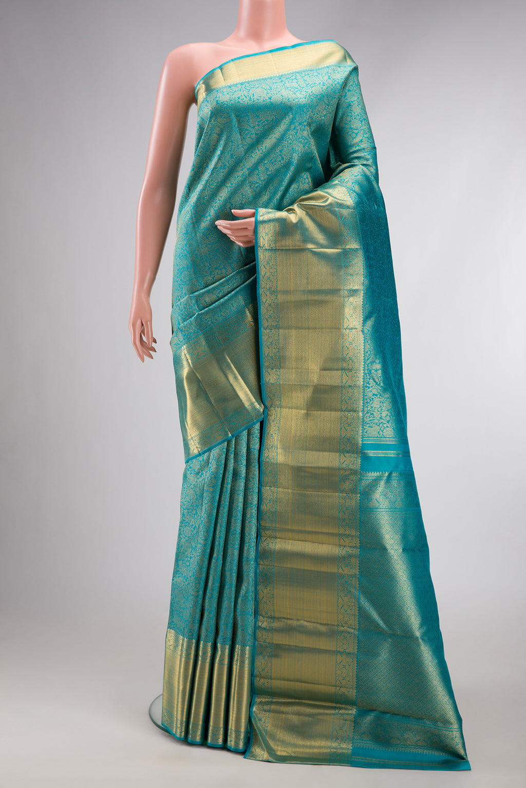 Pure Silk Pure Zari Sky Blue Kanjivaram Saree with Zari Brocade on the body and Zari Border.  displayed on a mannequin