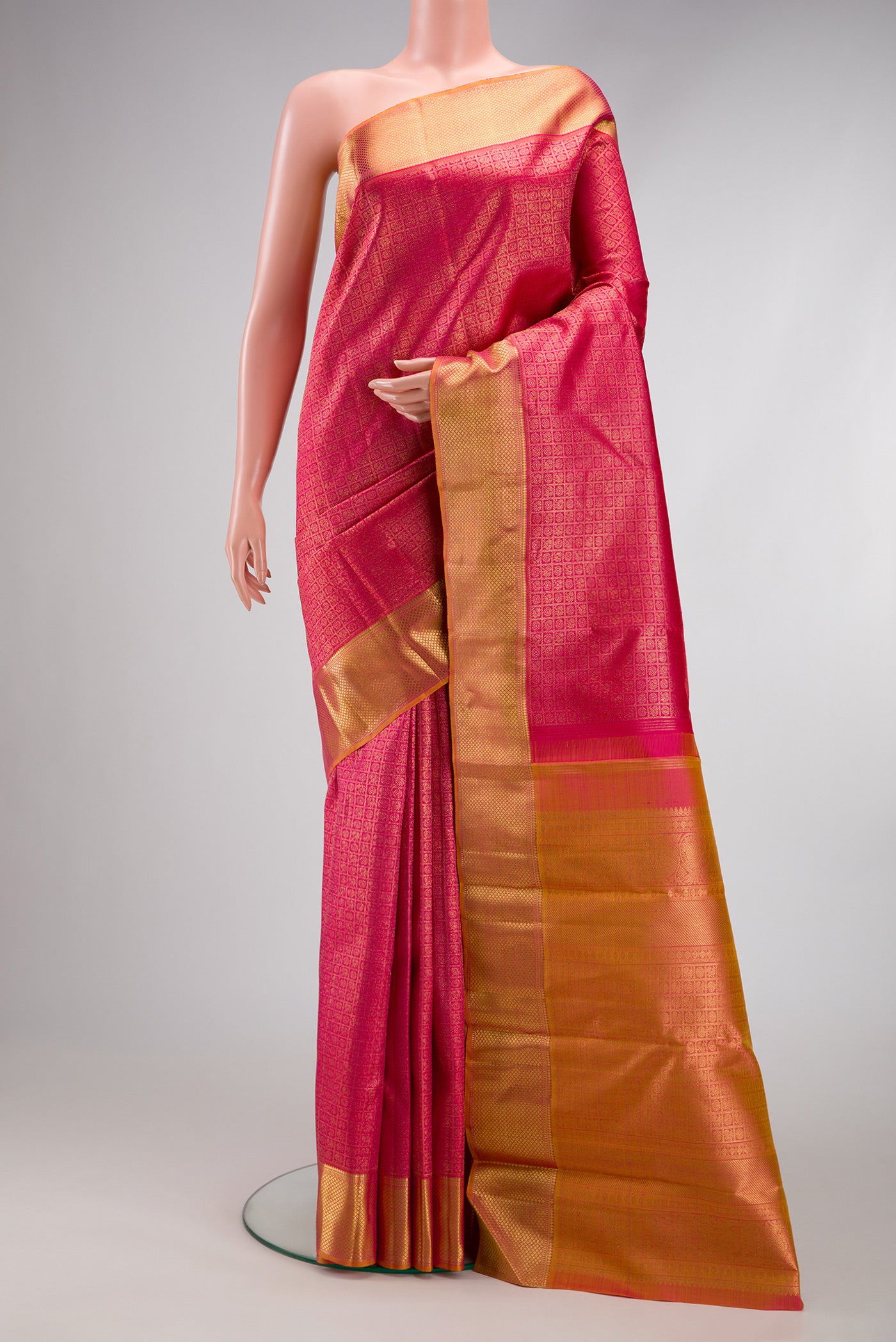 Pure Silk Pure Zari Pink Dual Tone Kanjivaram Saree with Zari Brocade on the body and Zari Border.  displayed on a mannequin