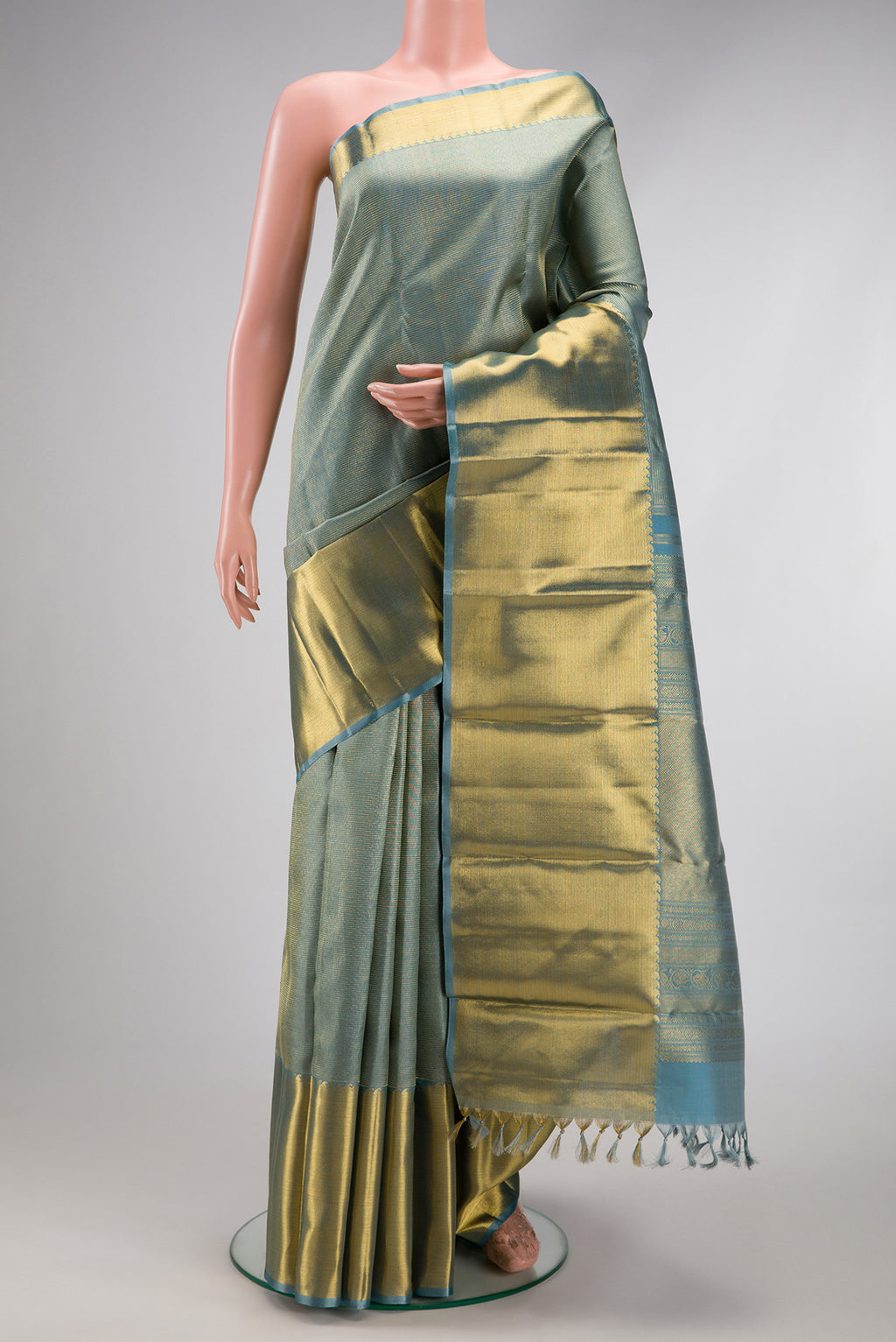 Pure Silk Pure Zari Blue Grey Dual Tone Kanjivaram Saree with Zari Brocade on the body and Zari Border.  displayed on a mannequin