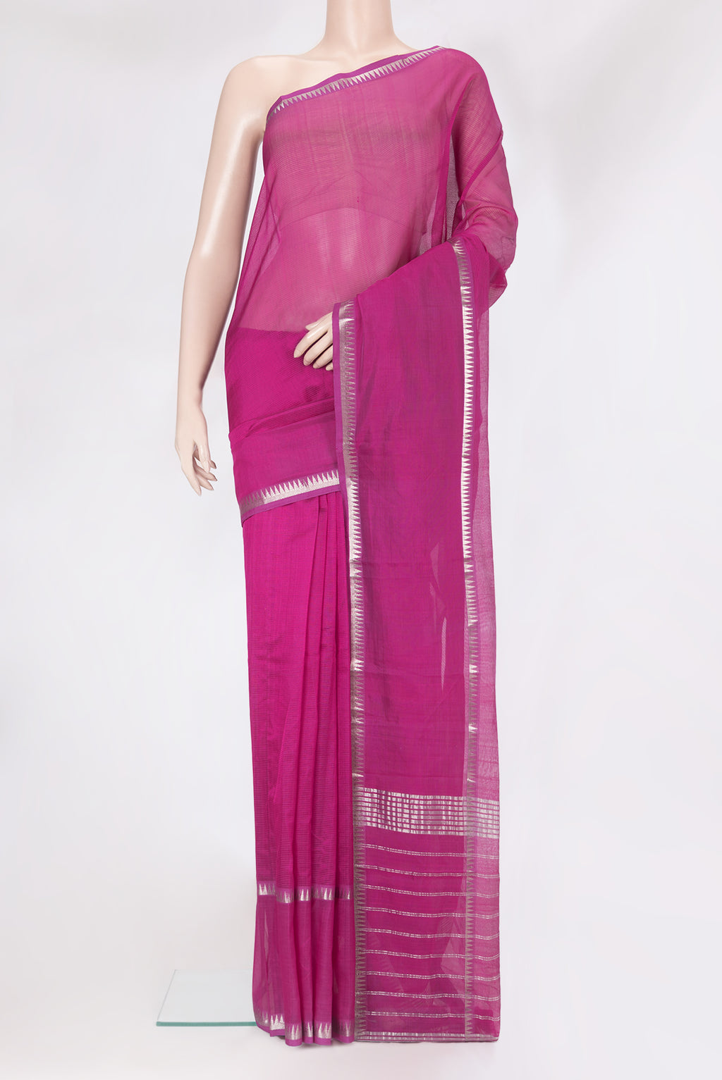 Magenta Silk Cotton Saree with Stripes on the body and Zari Border.  displayed on a mannequin