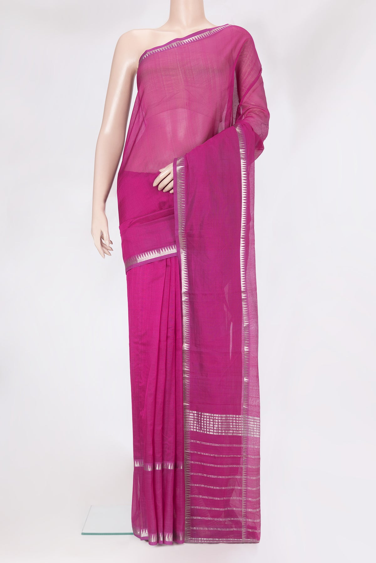 Magenta Silk Cotton Saree with Stripes on the body and Zari Border.  displayed on a mannequin