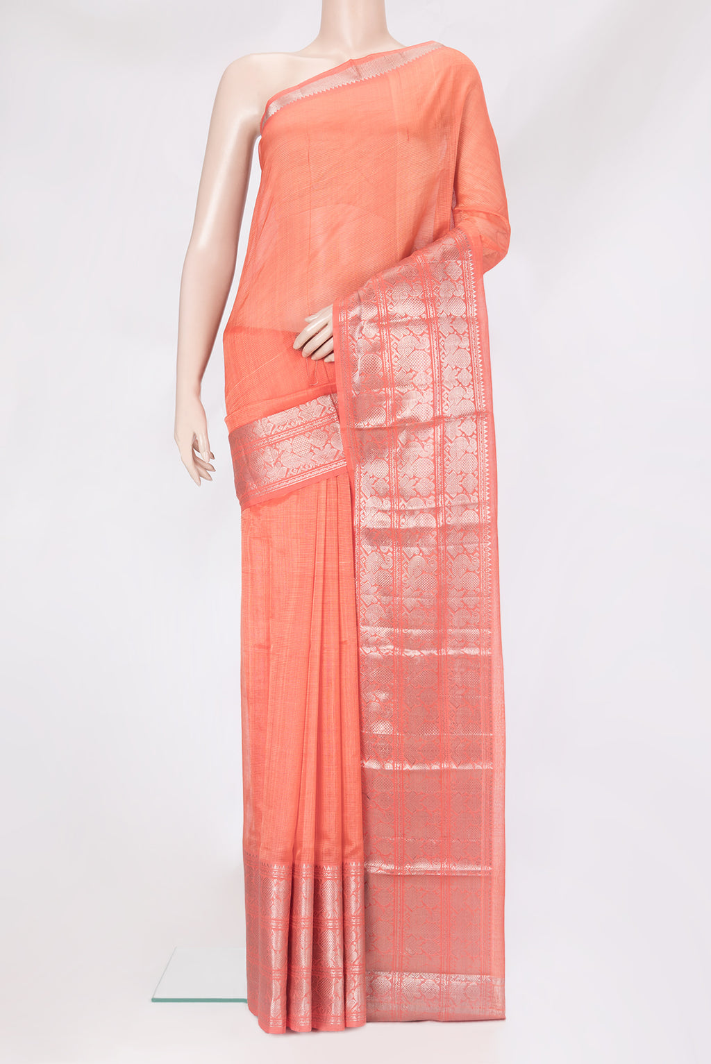 Peach Silk Cotton Saree with Stripes on the body and Zari Border.  displayed on a mannequin