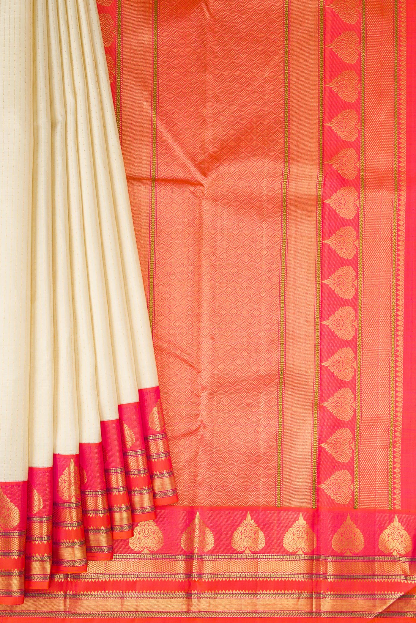 Pleats and pallu of Beige Dual Tone Kanchipuram Silk Saree with Stripes on the body and Fancy Border. 