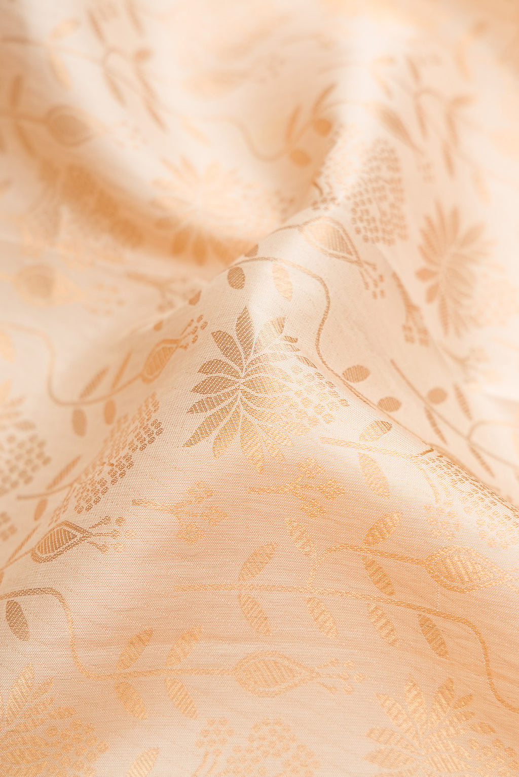 Close up of Sandal Kanjivaram Silk Saree with Zari Brocade on the body and Zari Border.  displaying folds