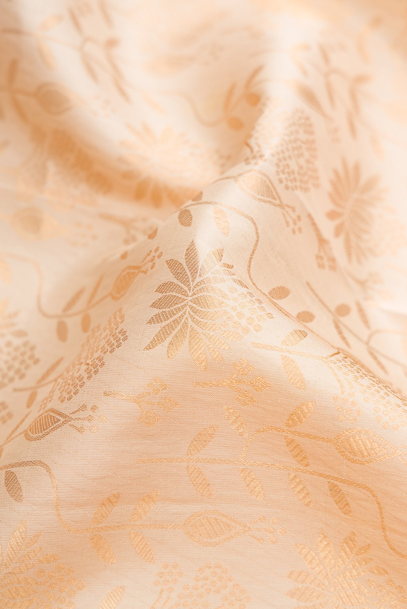 Close up of Sandal Kanjivaram Silk Saree with Zari Brocade on the body and Zari Border.  displaying folds
