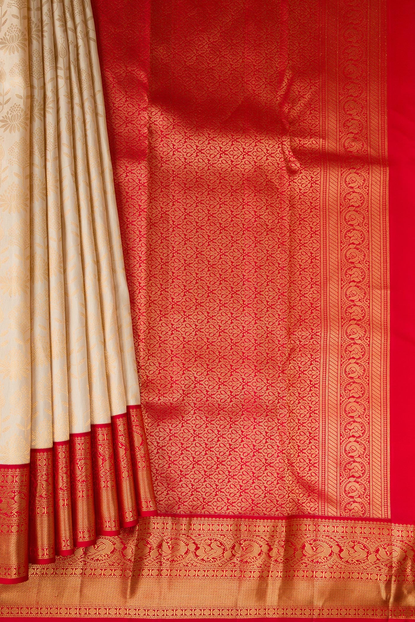 Pleats and pallu of Sandal Kanjivaram Silk Saree with Zari Brocade on the body and Zari Border. 