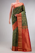 Bottle Green Kanjivaram Silk Saree with Zari Brocade on the body and Zari Border.  displayed on a mannequin