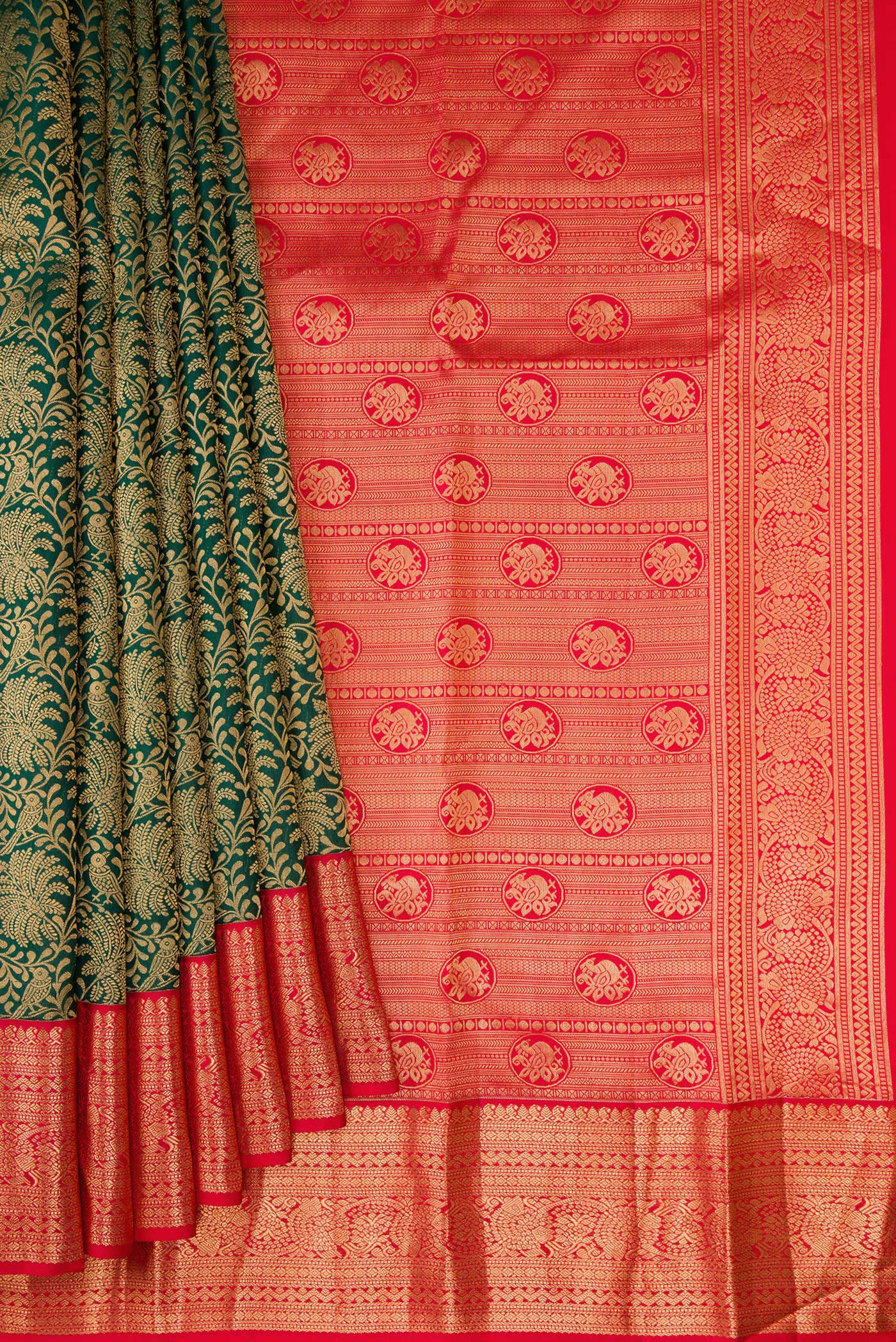 Pleats and pallu of Bottle Green Kanjivaram Silk Saree with Zari Brocade on the body and Zari Border. 