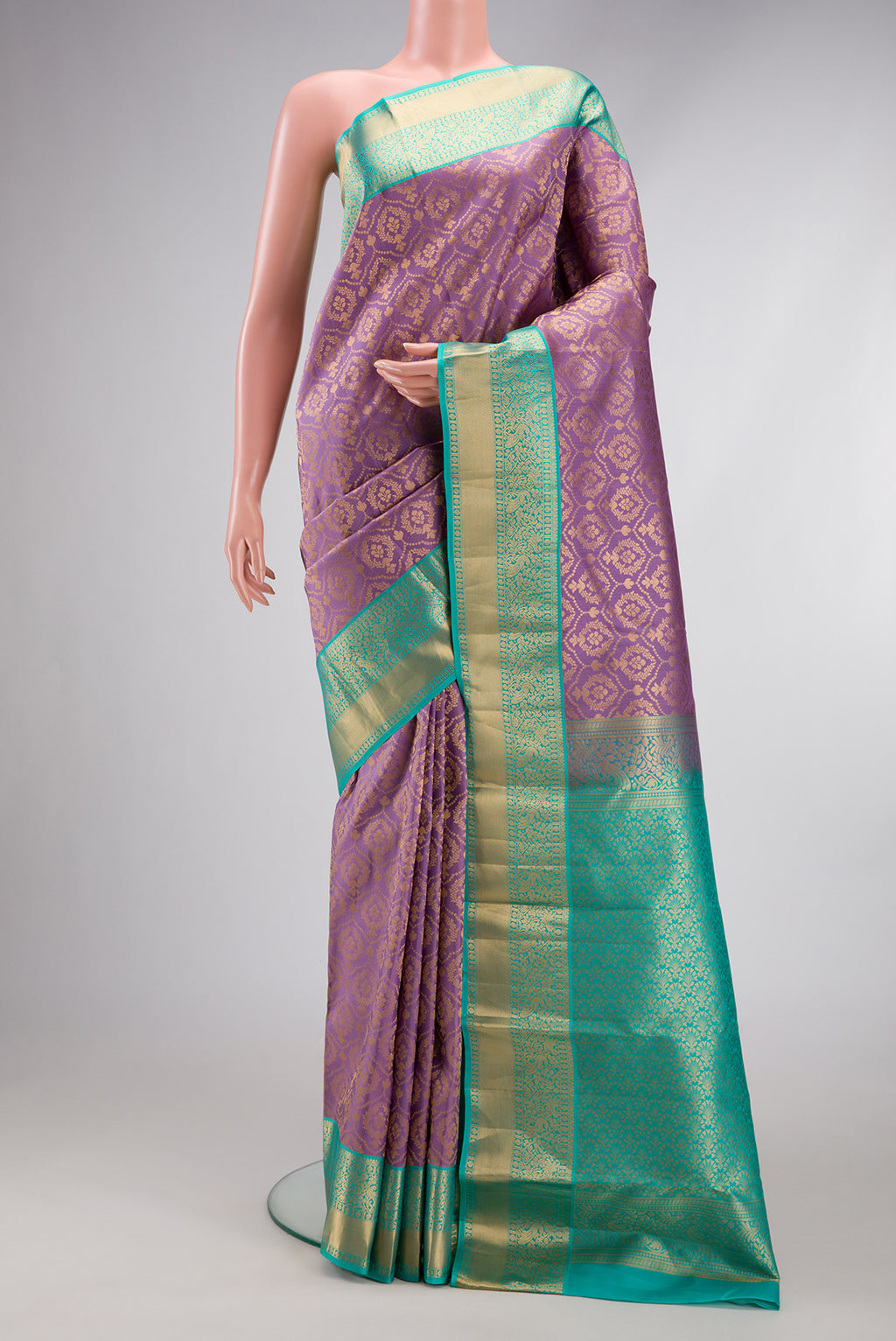 Lavender Kanjivaram Silk Saree with Zari Brocade on the body and Zari Border.  displayed on a mannequin