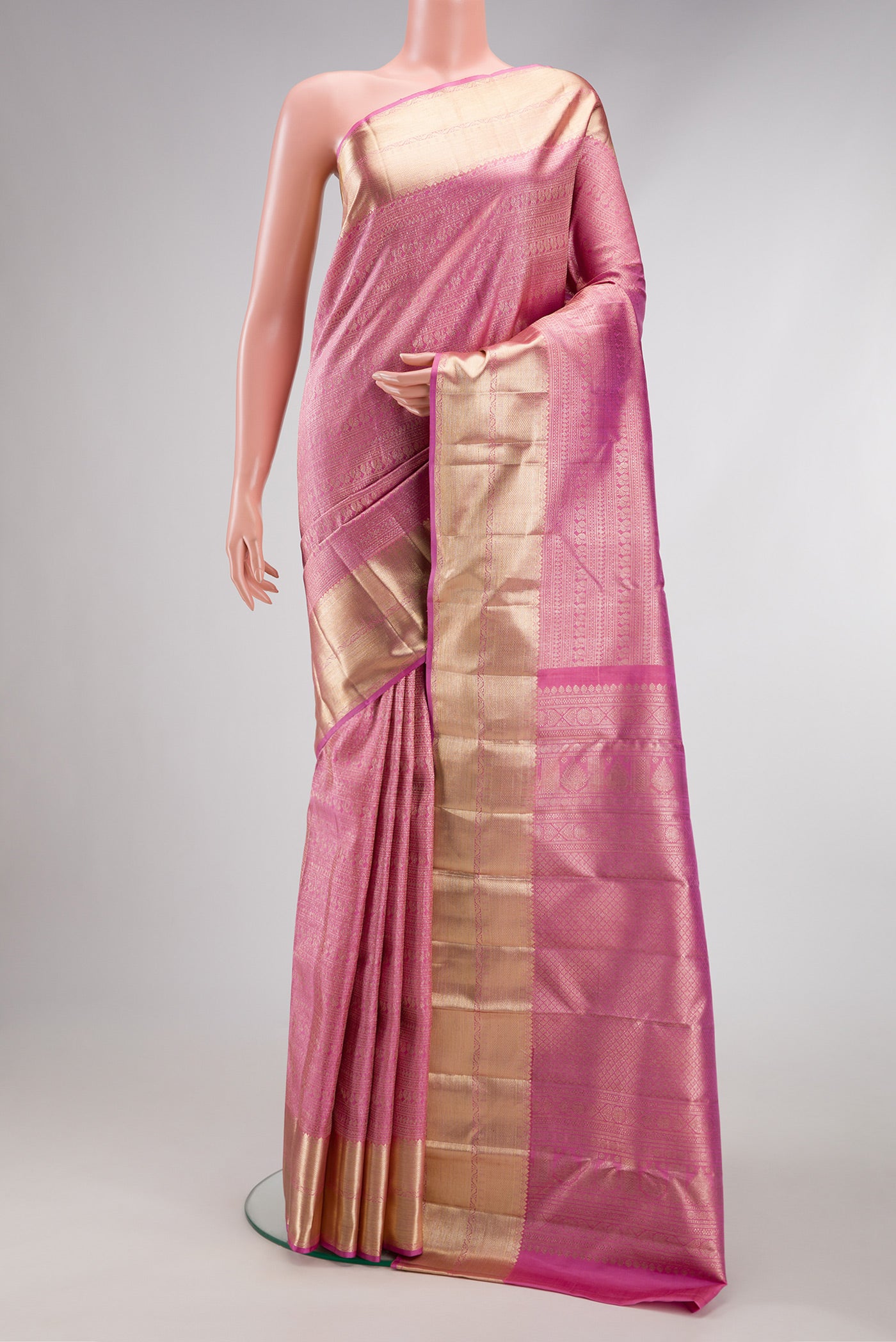 Pink Dual Tone Kanchipuram Silk Saree with Zari Brocade on the body and Zari Border.  displayed on a mannequin