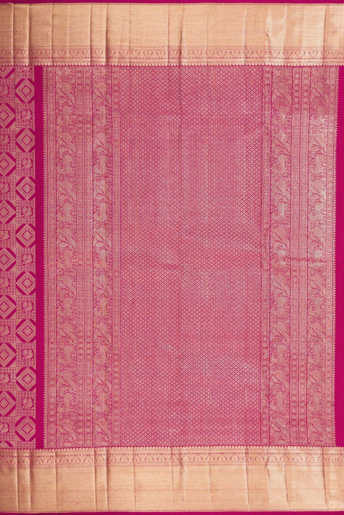 Close up image of the pallu of Magenta Dual Tone Kanchipuram Silk Saree with Zari Brocade on the body and Zari Border. 