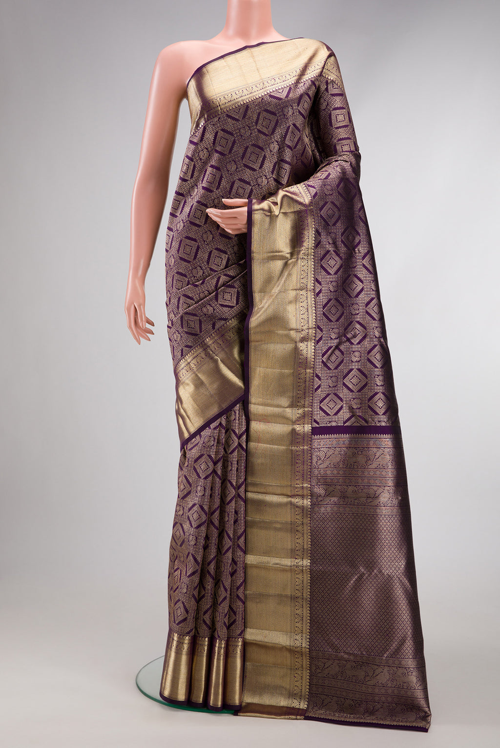 Violet Kanchipuram Silk Saree with Zari Brocade on the body and Zari Border.  displayed on a mannequin
