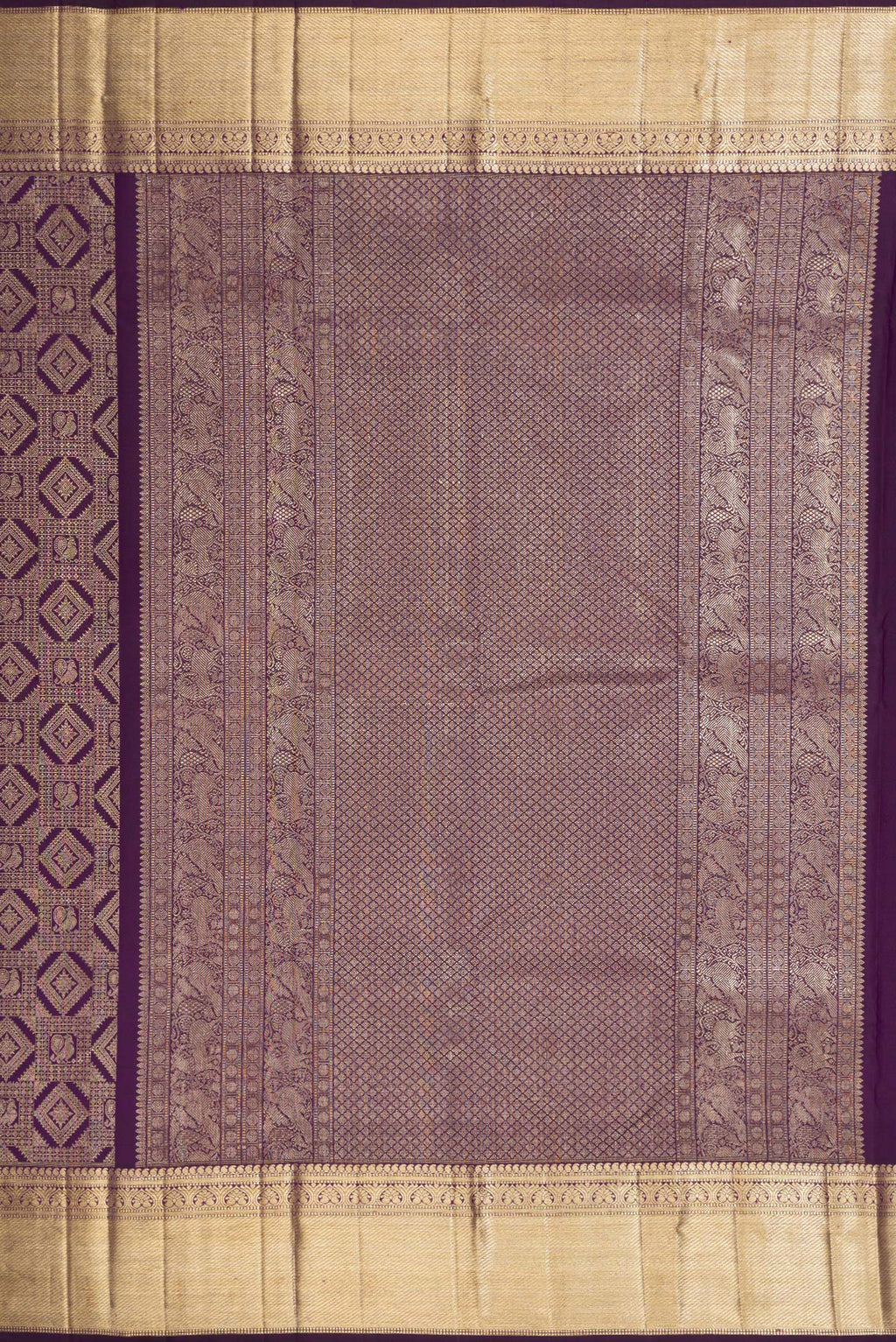 Close up image of the pallu of Violet Kanchipuram Silk Saree with Zari Brocade on the body and Zari Border. 
