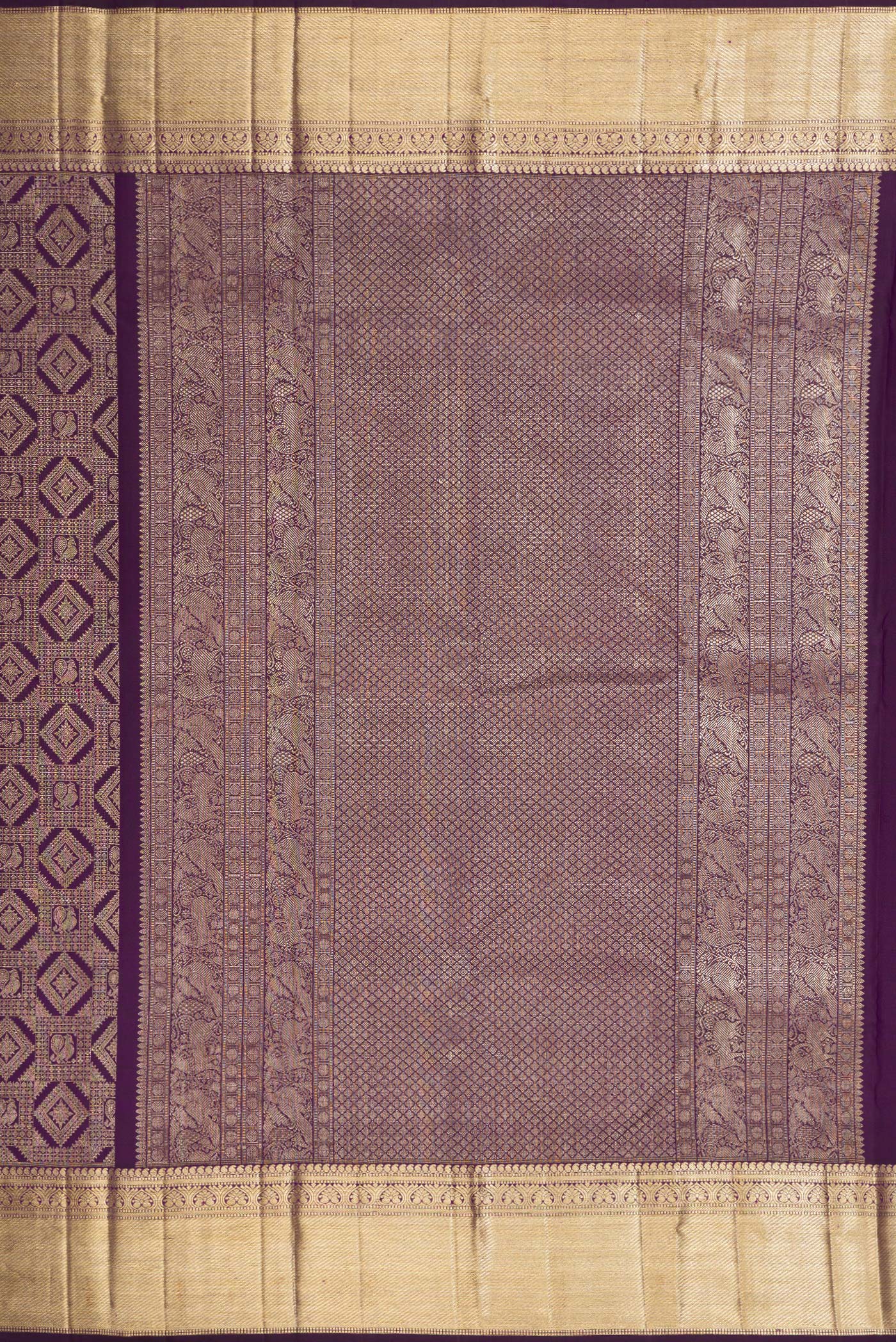 Close up image of the pallu of Violet Kanchipuram Silk Saree with Zari Brocade on the body and Zari Border. 