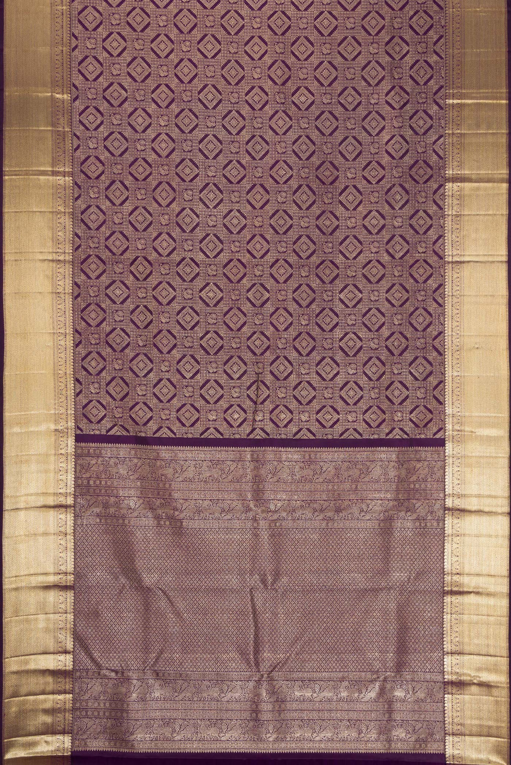 Flat view of Violet Kanchipuram Silk Saree with Zari Brocade on the body and Zari Border. 