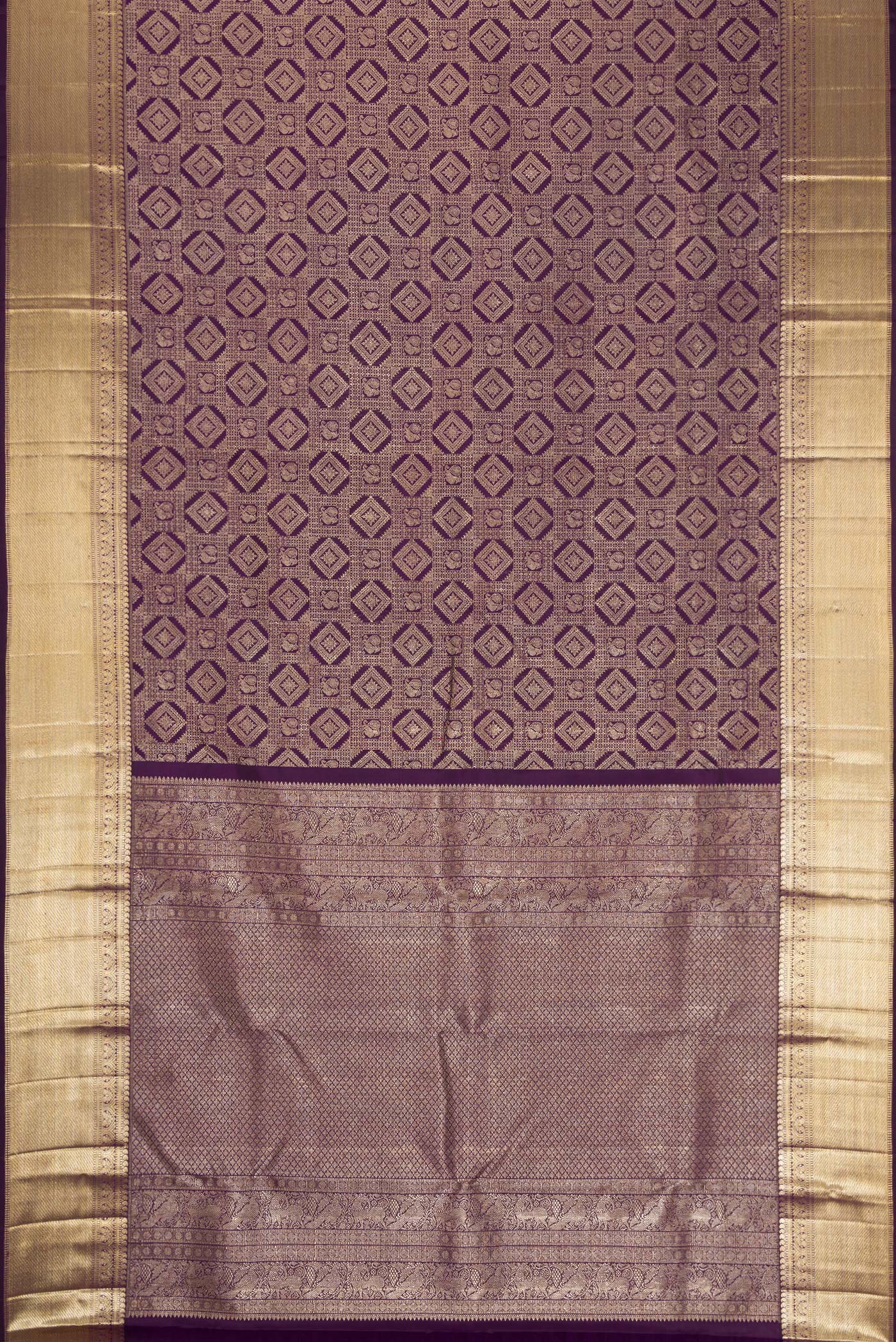 Flat view of Violet Kanchipuram Silk Saree with Zari Brocade on the body and Zari Border. 