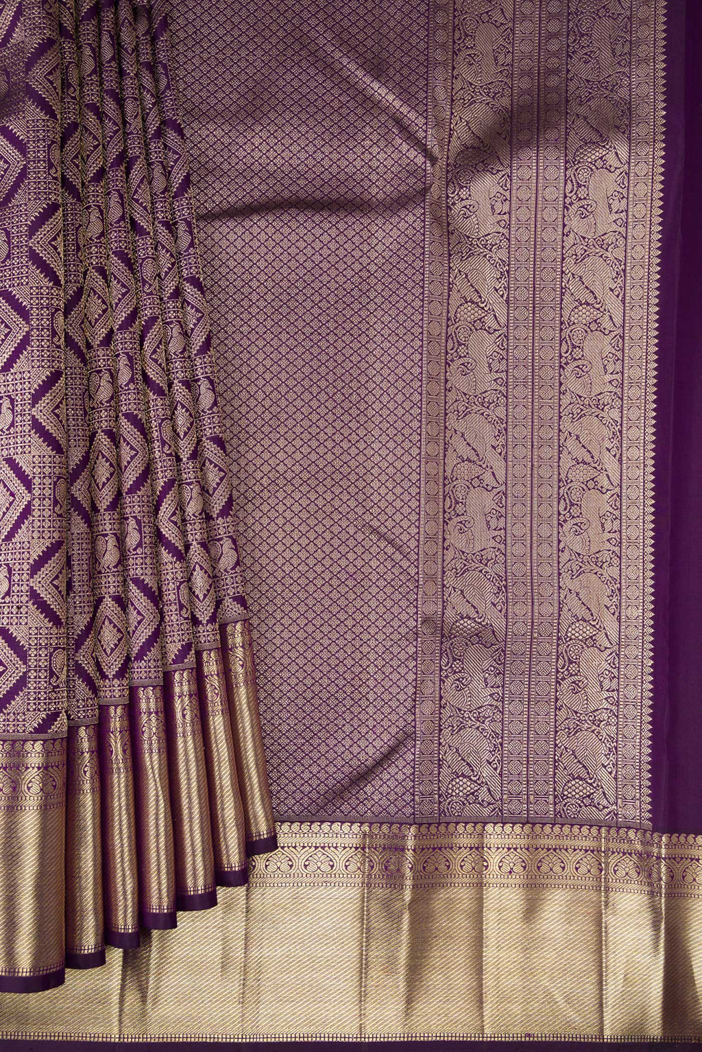 Pleats and pallu of Violet Kanchipuram Silk Saree with Zari Brocade on the body and Zari Border. 