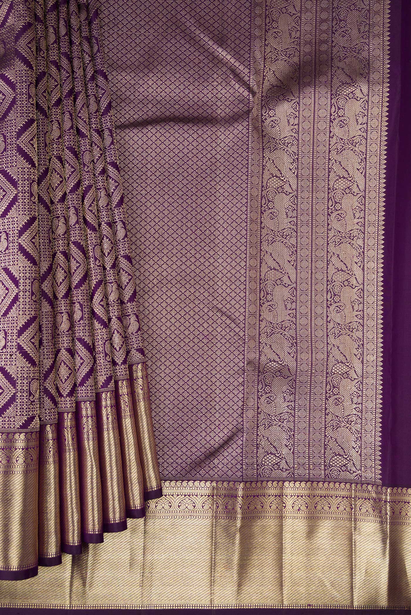 Pleats and pallu of Violet Kanchipuram Silk Saree with Zari Brocade on the body and Zari Border. 