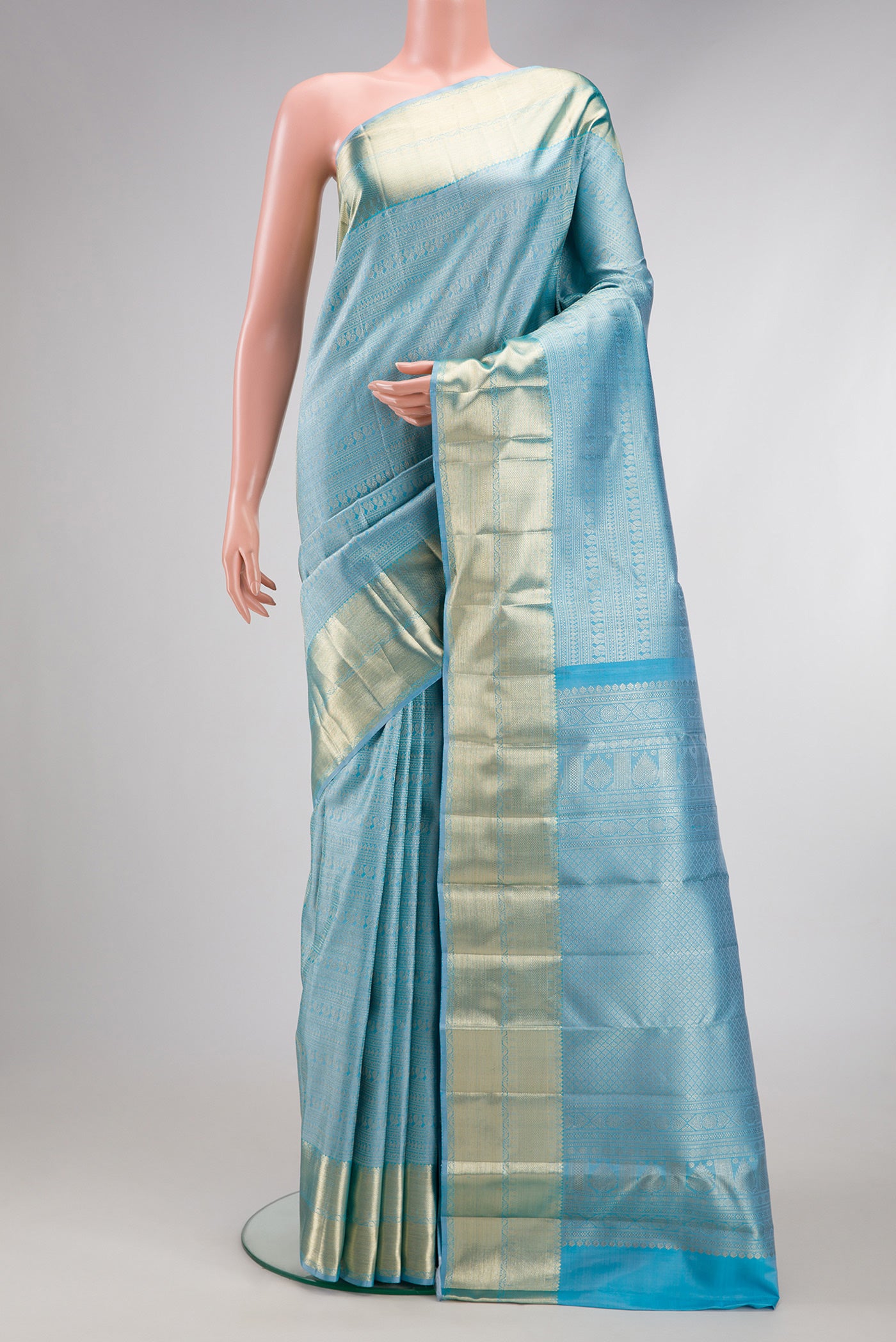 Sky Blue Kanchipuram Silk Saree with Zari Brocade on the body and Zari Border.  displayed on a mannequin