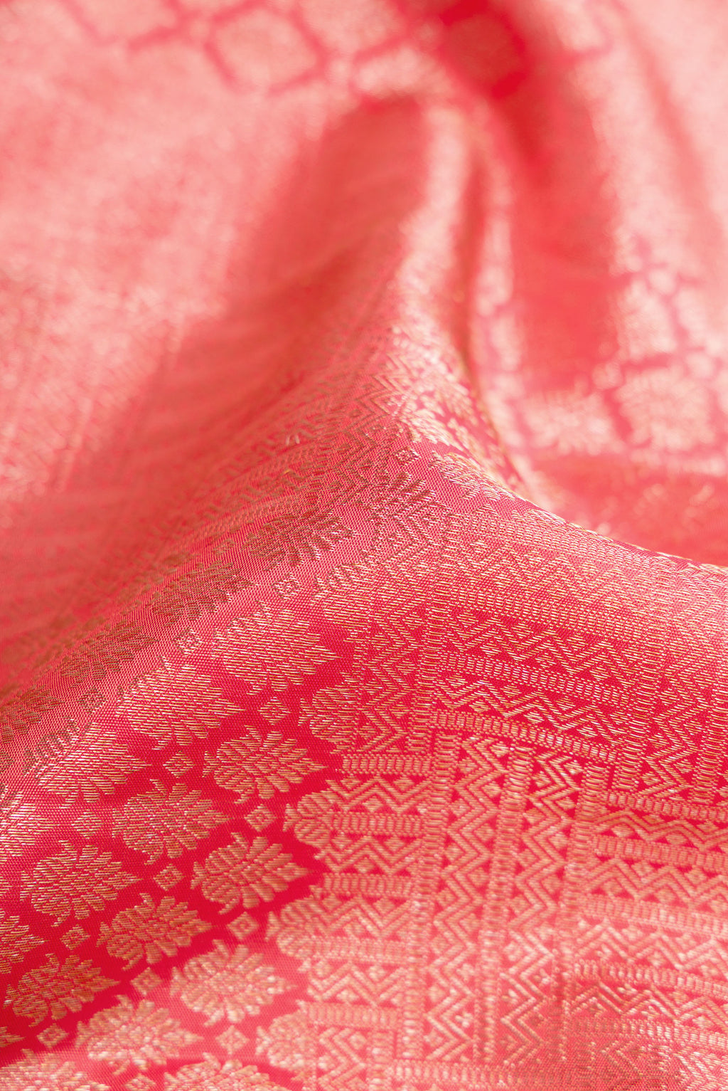 Close up of Pink Dual Tone Kanchipuram Silk Saree with Zari Brocade on the body and Zari Border.  displaying folds