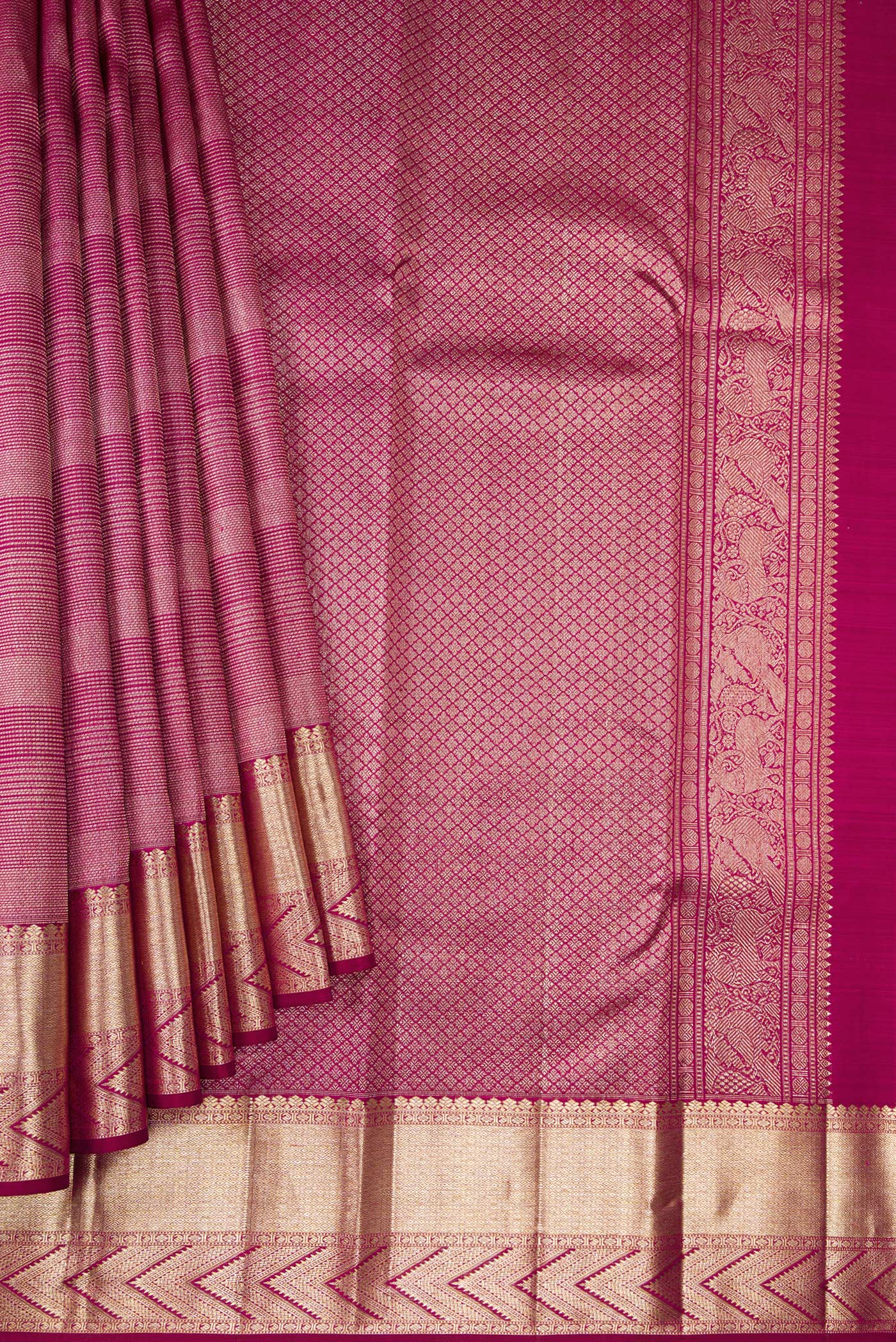 Pleats and pallu of Magenta Kanchipuram Silk Saree with Zari Brocade on the body and Zari Border. 