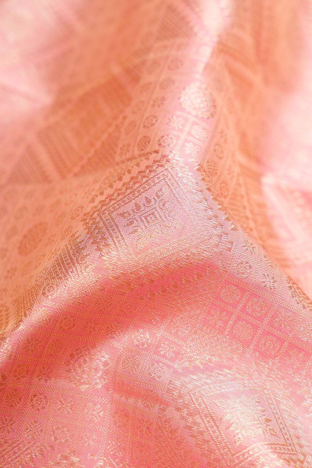 Close up of Rose pink Dual Tone Kanchipuram Silk Saree with Zari Brocade on the body and Zari Border.  displaying folds