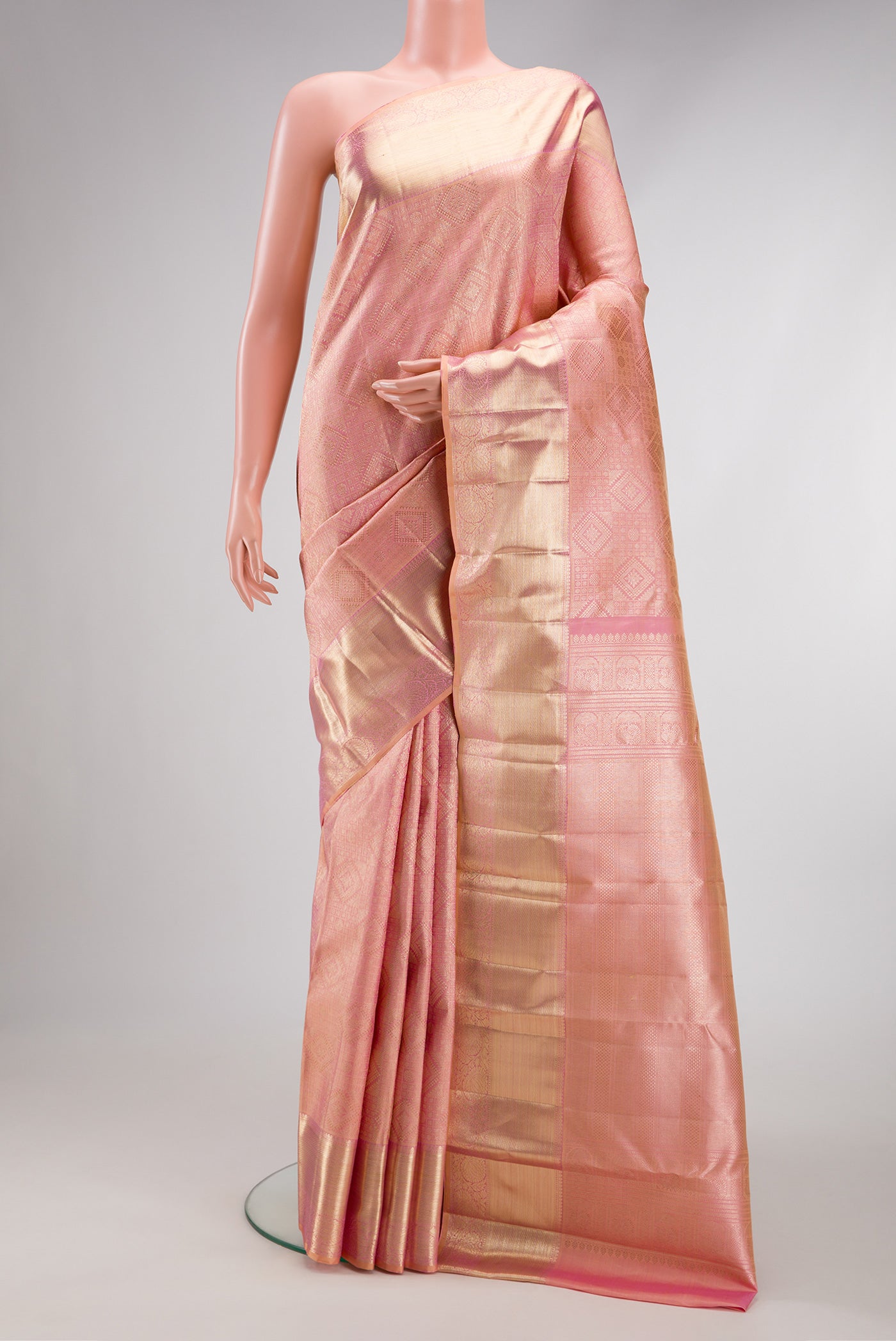 Rose pink Dual Tone Kanchipuram Silk Saree with Zari Brocade on the body and Zari Border.  displayed on a mannequin
