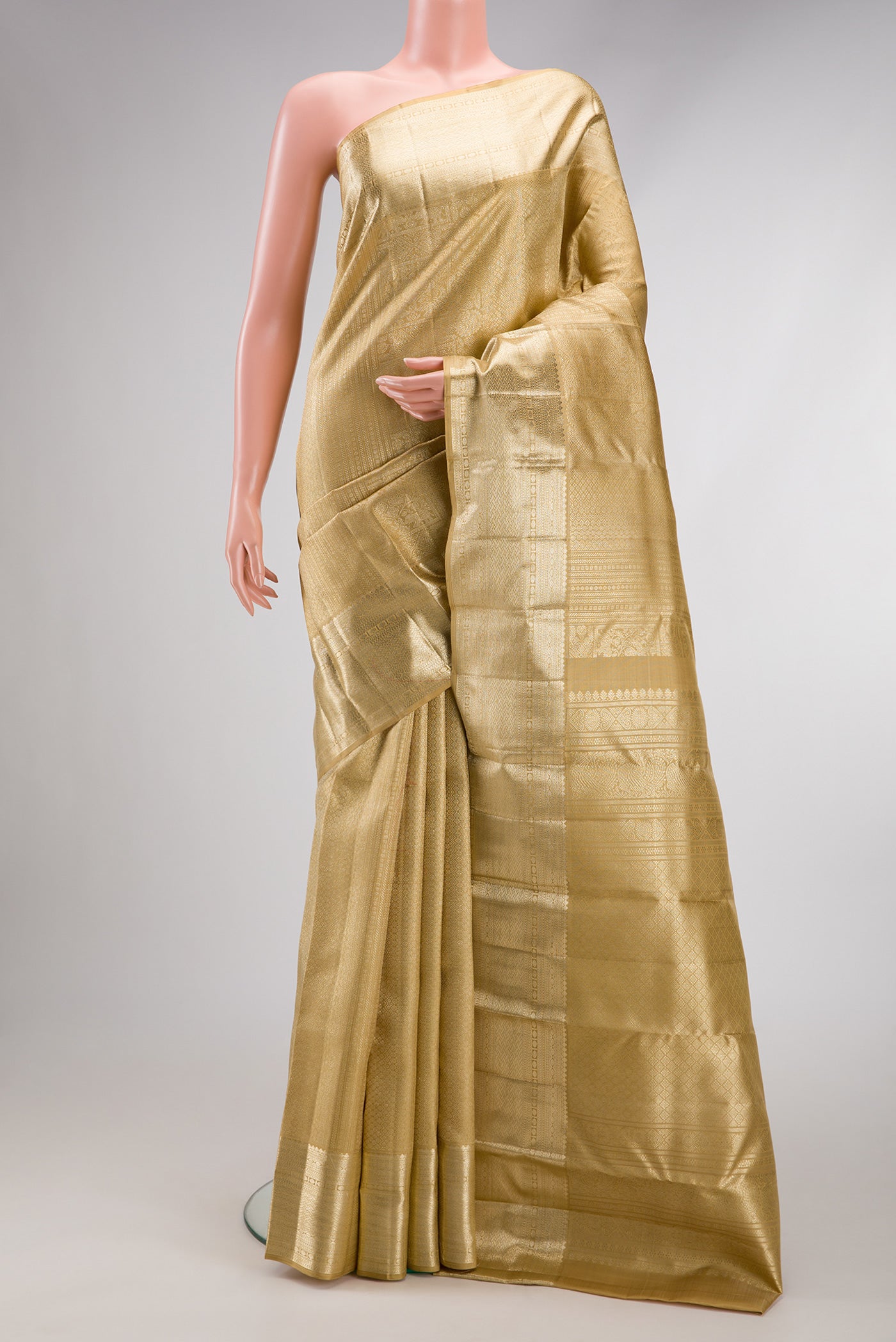 Dark Beige Dual Tone Kanchipuram Silk Saree with Zari Brocade on the body and Zari Border.  displayed on a mannequin