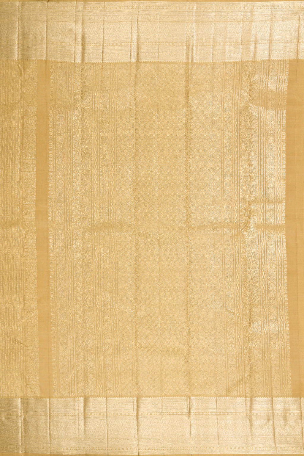 Close up image of the pallu of Dark Beige Dual Tone Kanchipuram Silk Saree with Zari Brocade on the body and Zari Border. 
