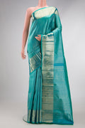 Turquoise Dual Tone Kanchipuram Silk Saree with Zari Brocade on the body and Zari Border.  displayed on a mannequin