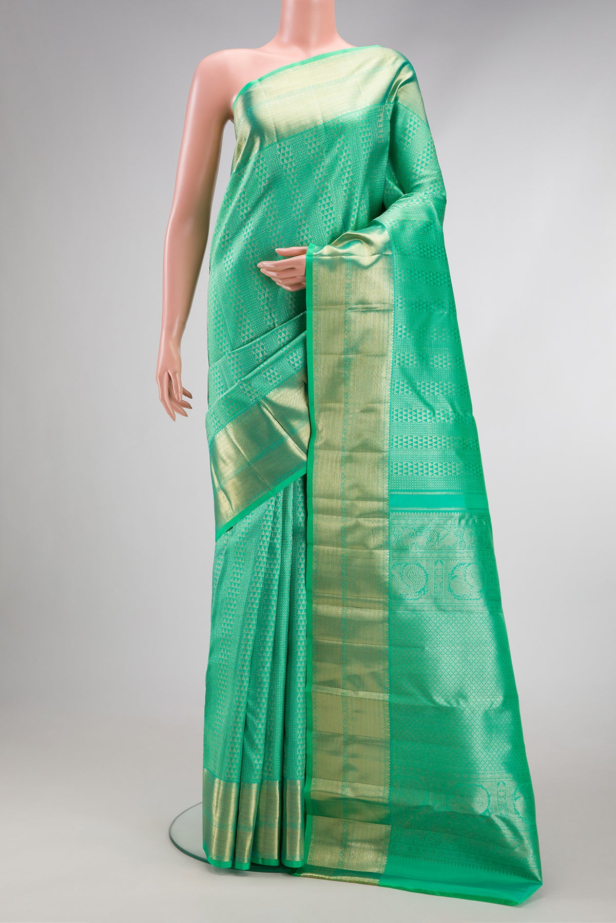 Sea Green Dual Tone Kanchipuram Silk Saree with Zari Brocade on the body and Zari Border.  displayed on a mannequin