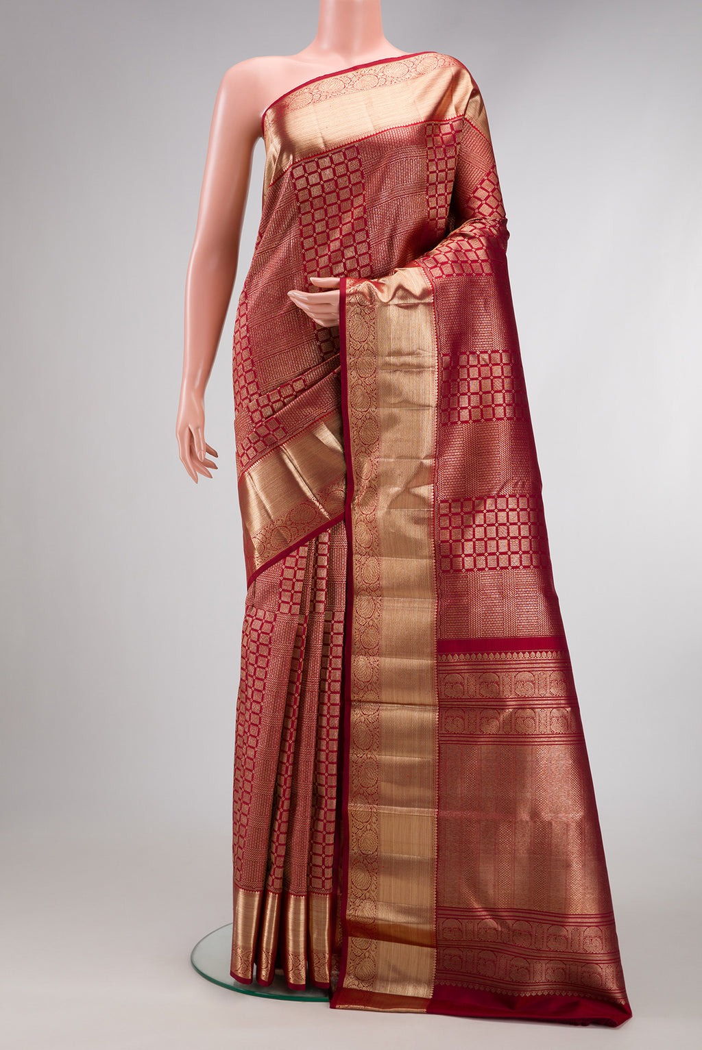 Maroon Kanchipuram Silk Saree with Zari Brocade on the body and Zari Border.  displayed on a mannequin